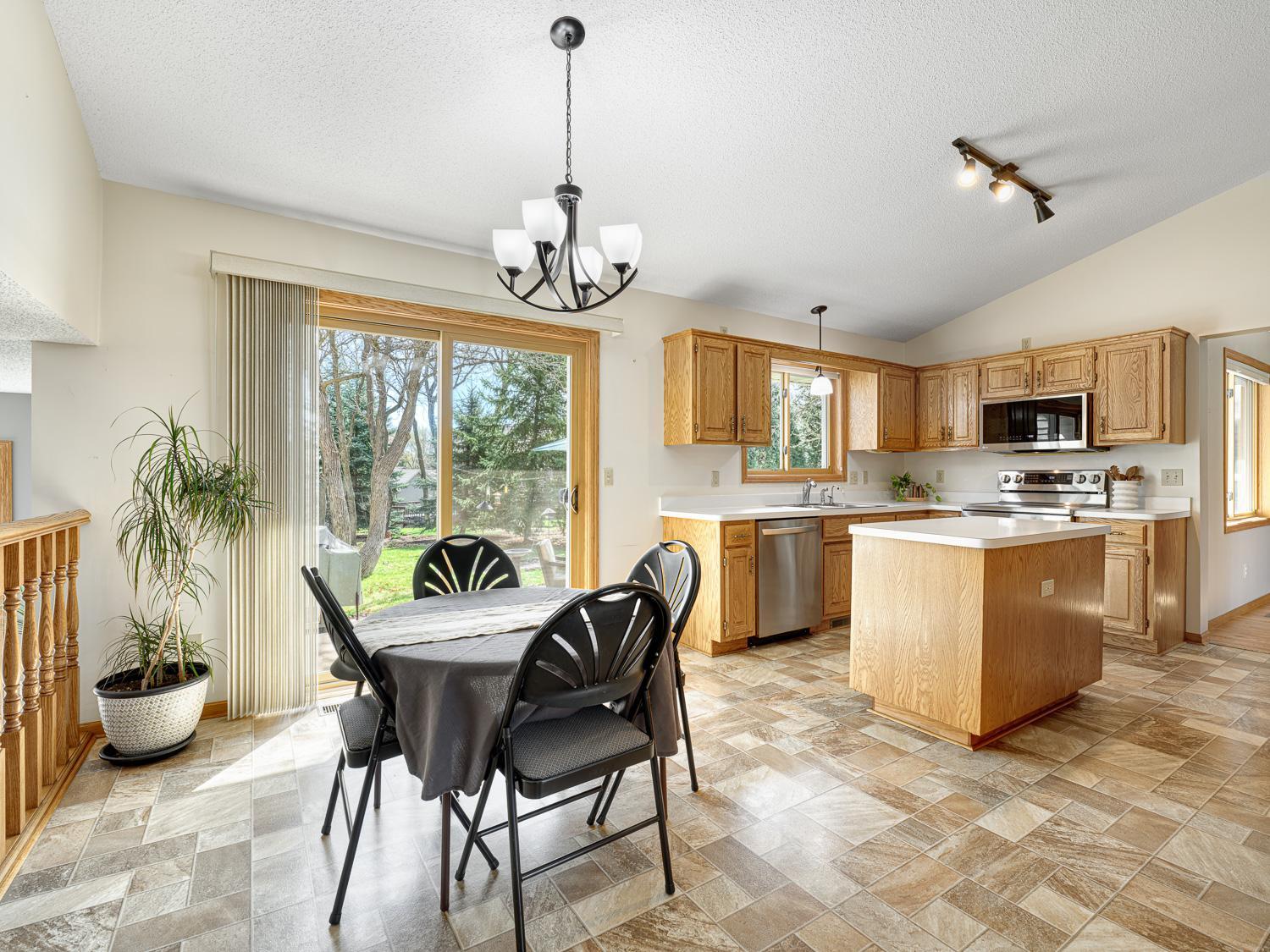 The informal dining area opens to the kitchen and is perfect for quick meals, with walk-out access to a relaxing patio.