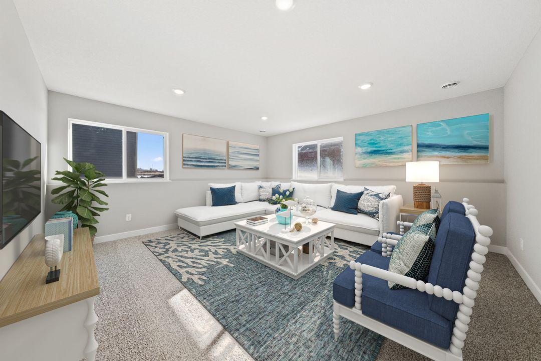 Lower level family room. How great to have two living spaces! Actual home is a walkout basement.