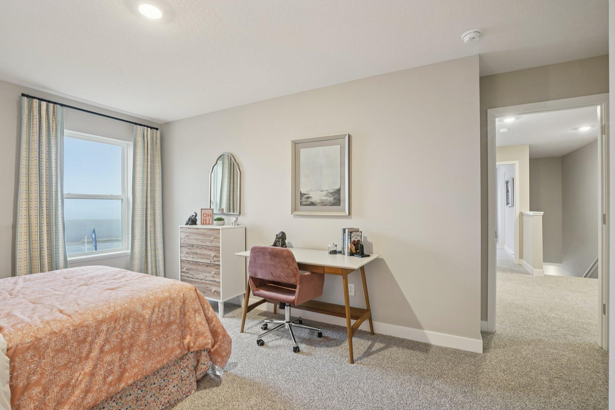 Spacious bedrooms on the upper level. Photo of model home, color and options will vary.