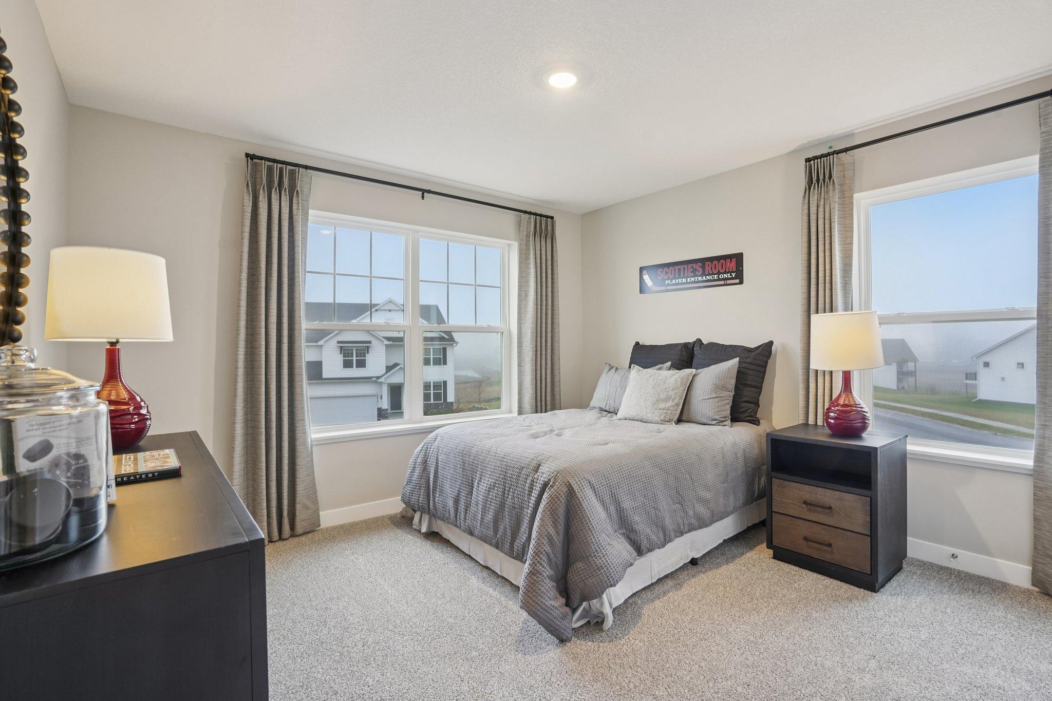 Spacious bedrooms on the upper level. Photo of model home, color and options will vary.