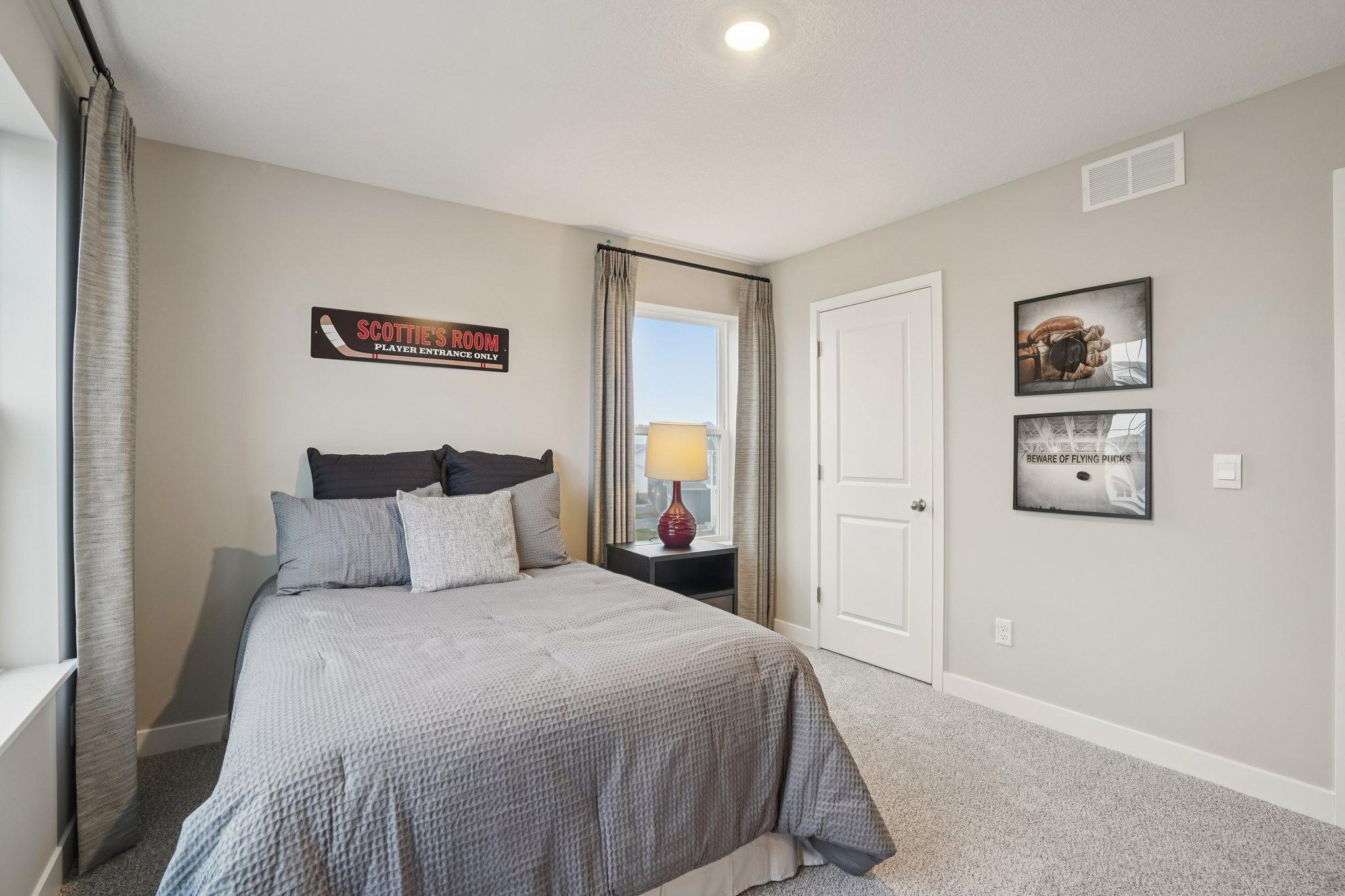 Spacious bedrooms on the upper level. Photo of model home, color and options will vary.