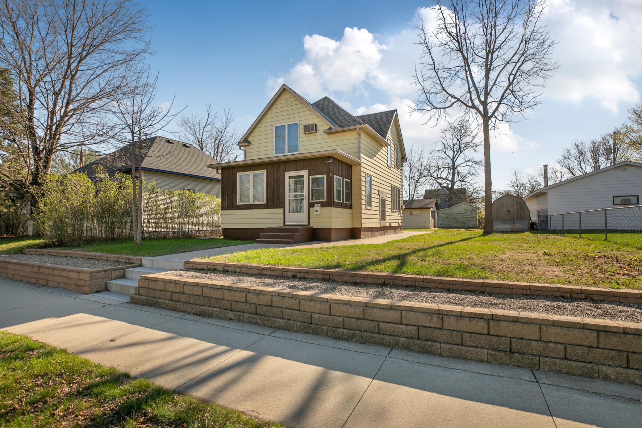 Welcome to 426 20th Ave N, St Cloud. Great curb appeal with mature trees and beautiful landscaping.
