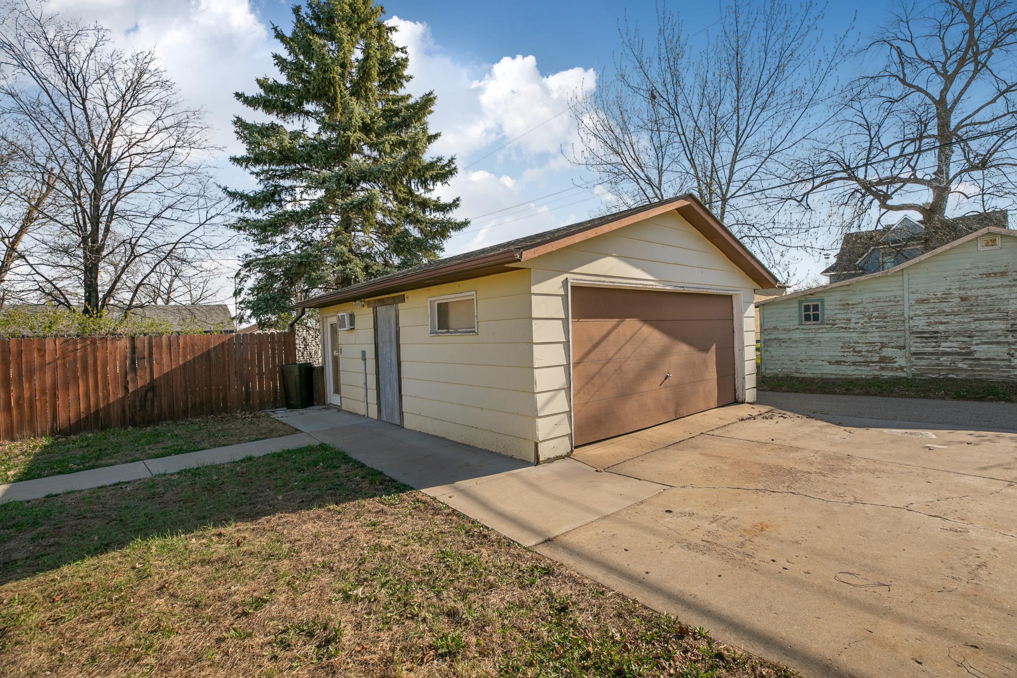 Large 20x24 detached garage with a built-in wall air conditioner and it’s already equipped for a natural gas heater.