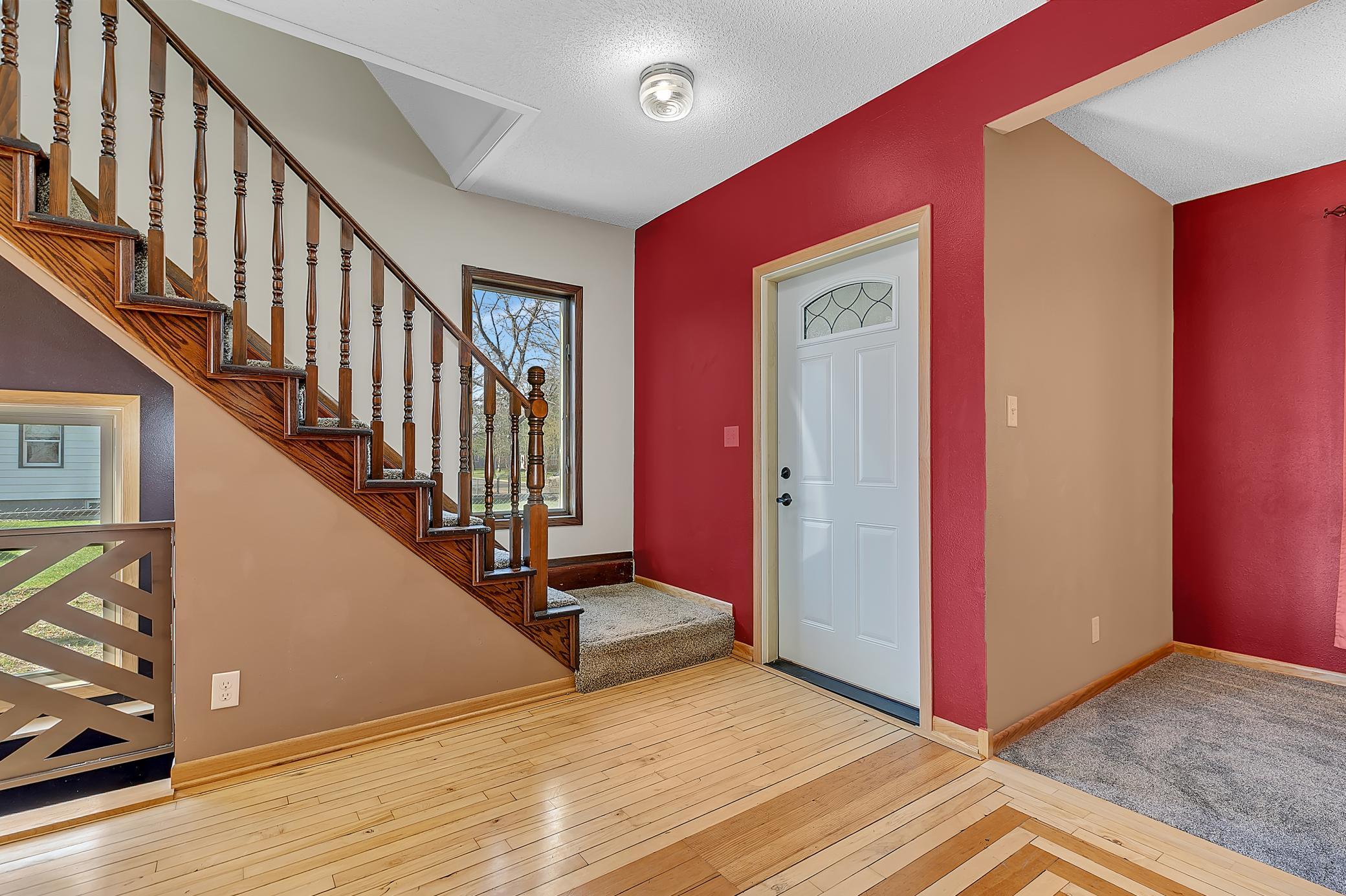 Staircase off to the side so that it doesn’t restrict movement through the rooms.