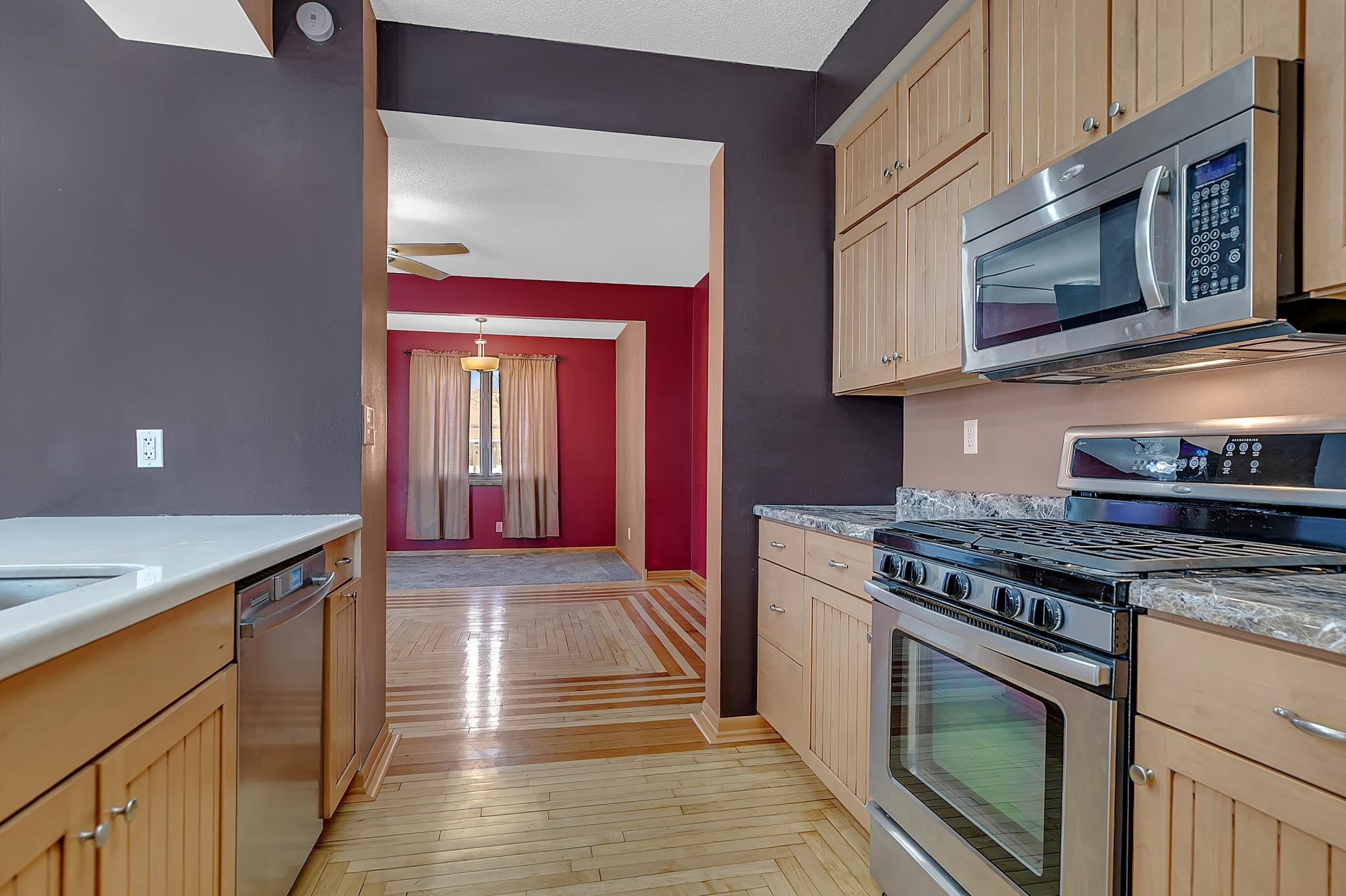 The kitchen is designed with both style and function in mind. It features stainless steel appliances, and all kitchen appliances will stay with the home.
