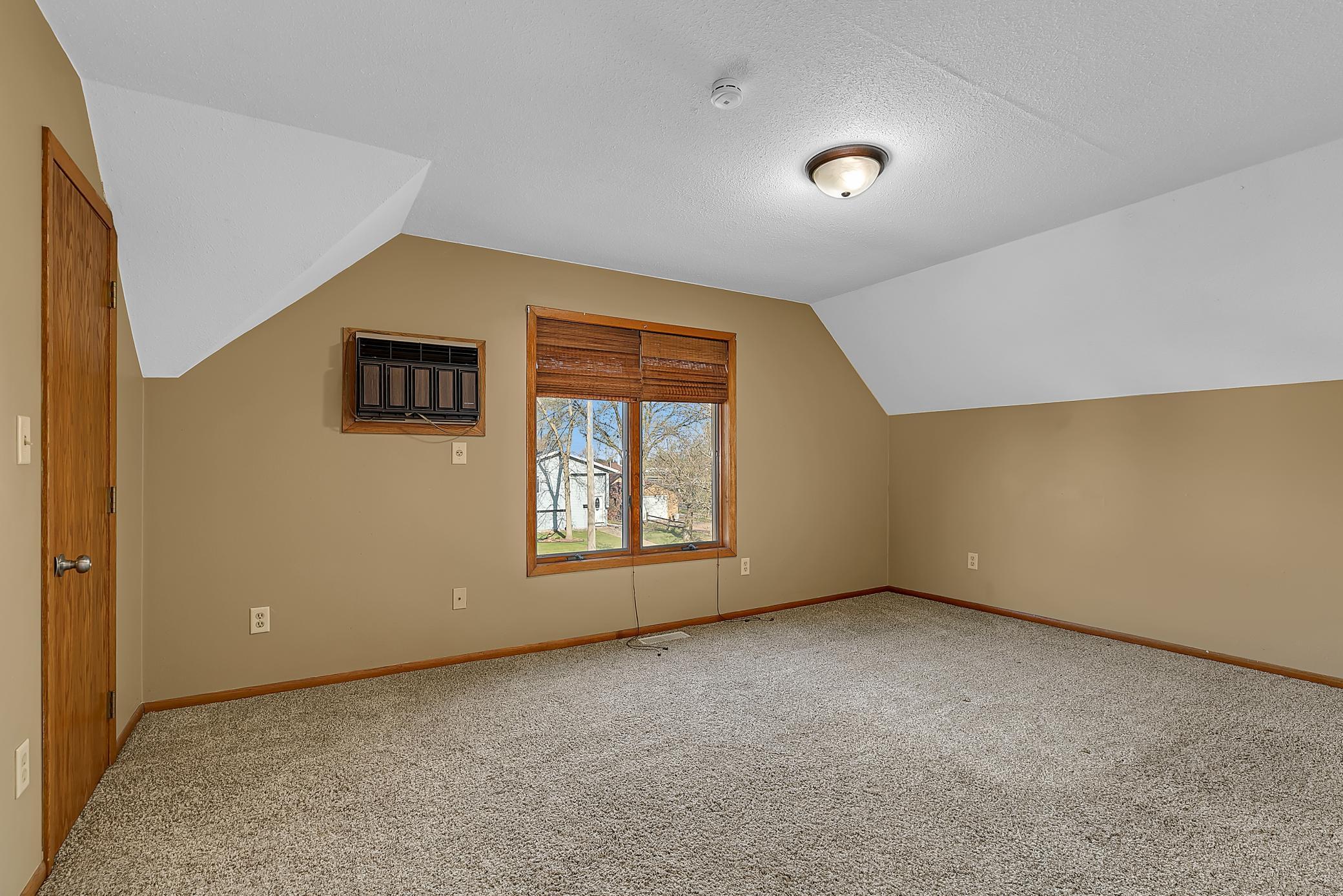 Large primary bedroom with walk-in closet.