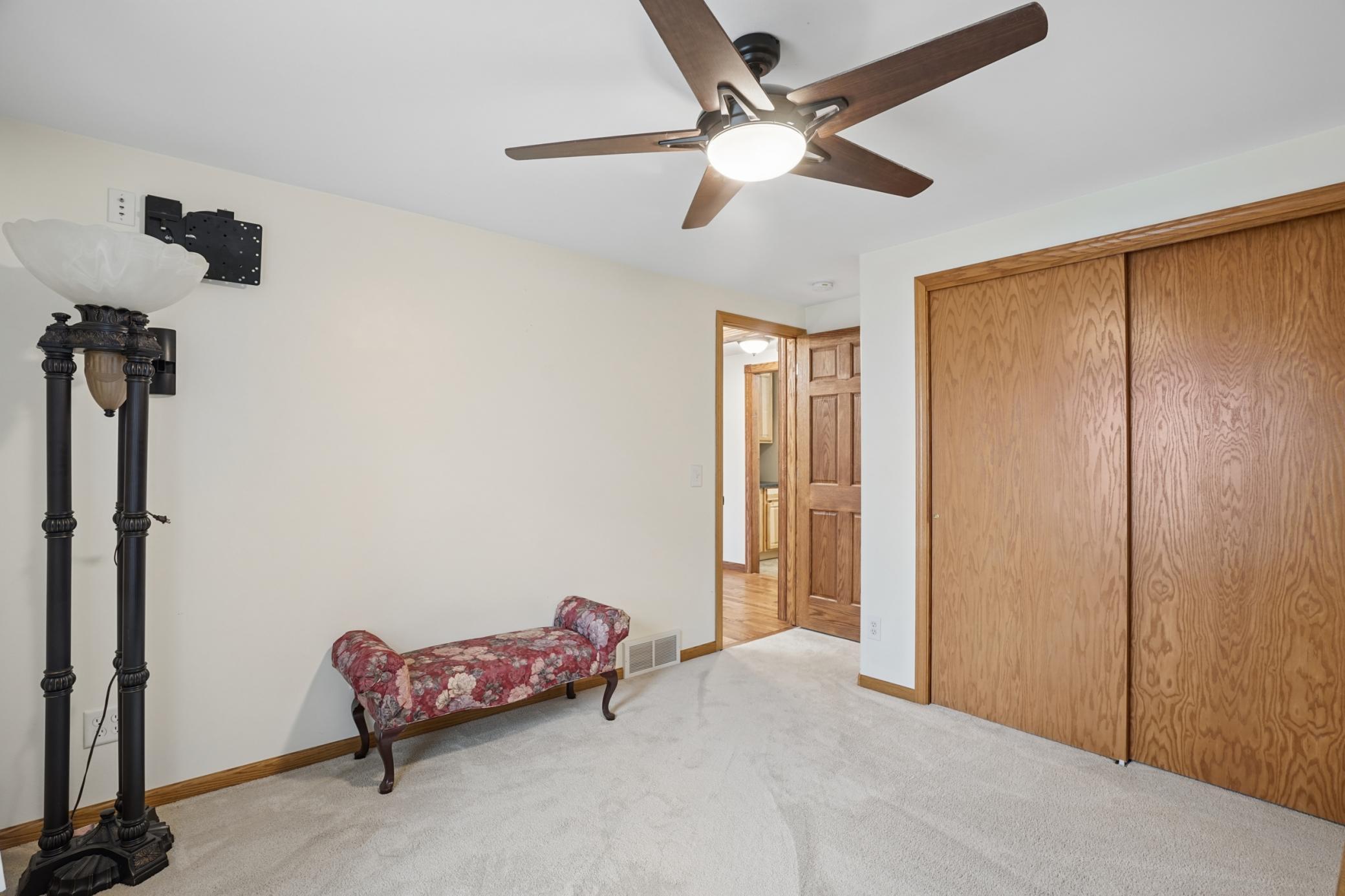 The second main floor bedroom features a spacious closet.
