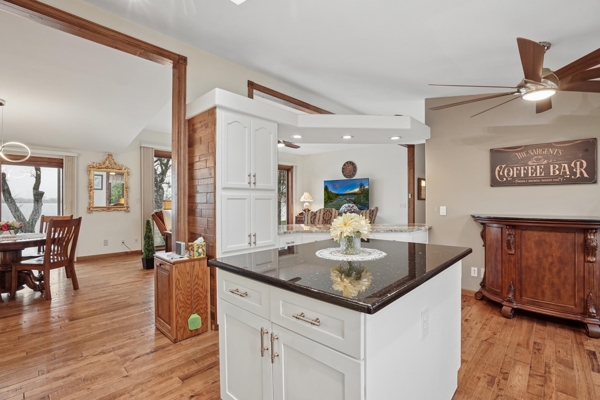 The kitchen features a pantry. The cabinets feature pull-outs and soft-close drawers.