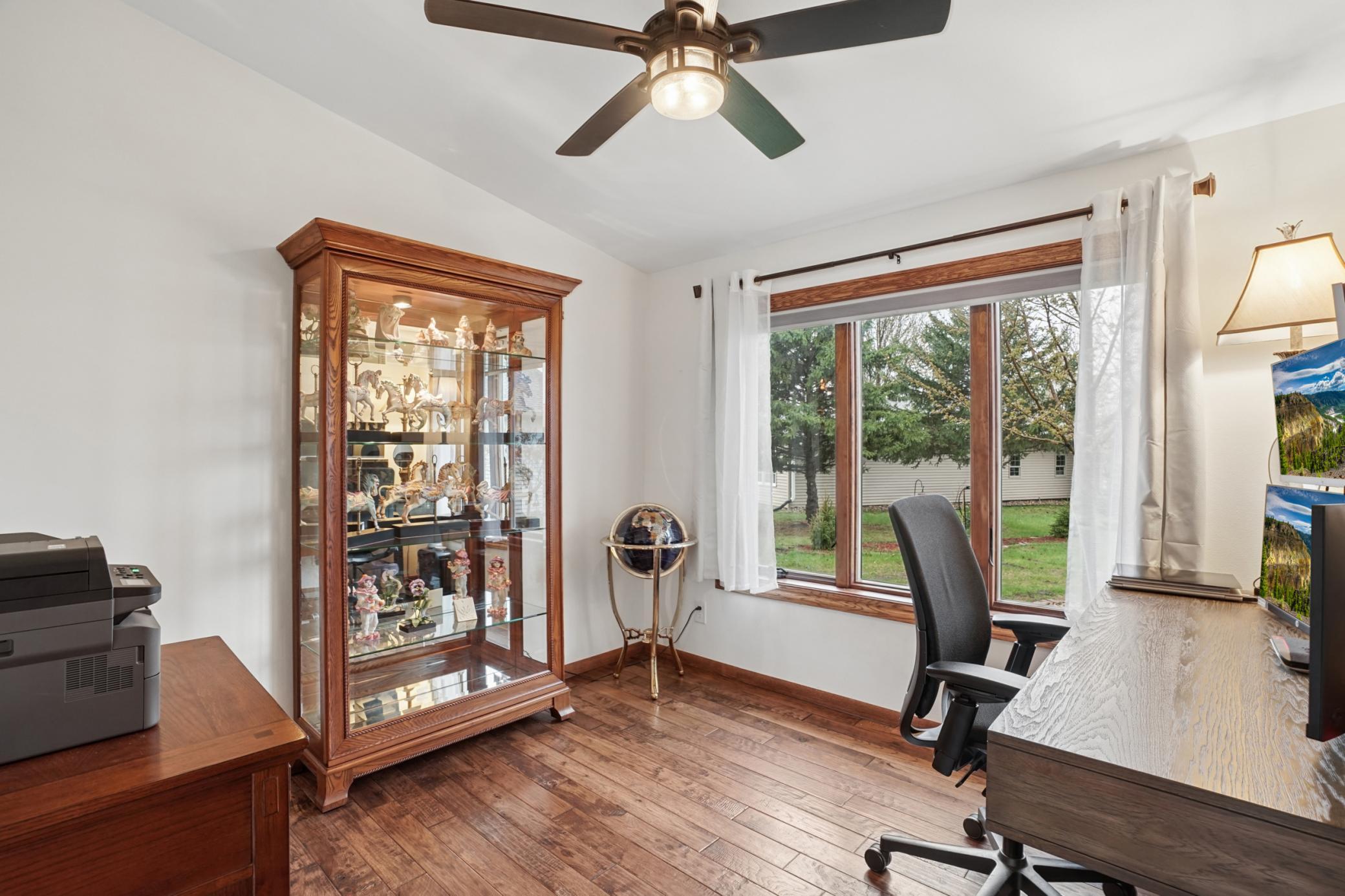 The dedicated office features beautiful Georgia Hickory hardwood floors.