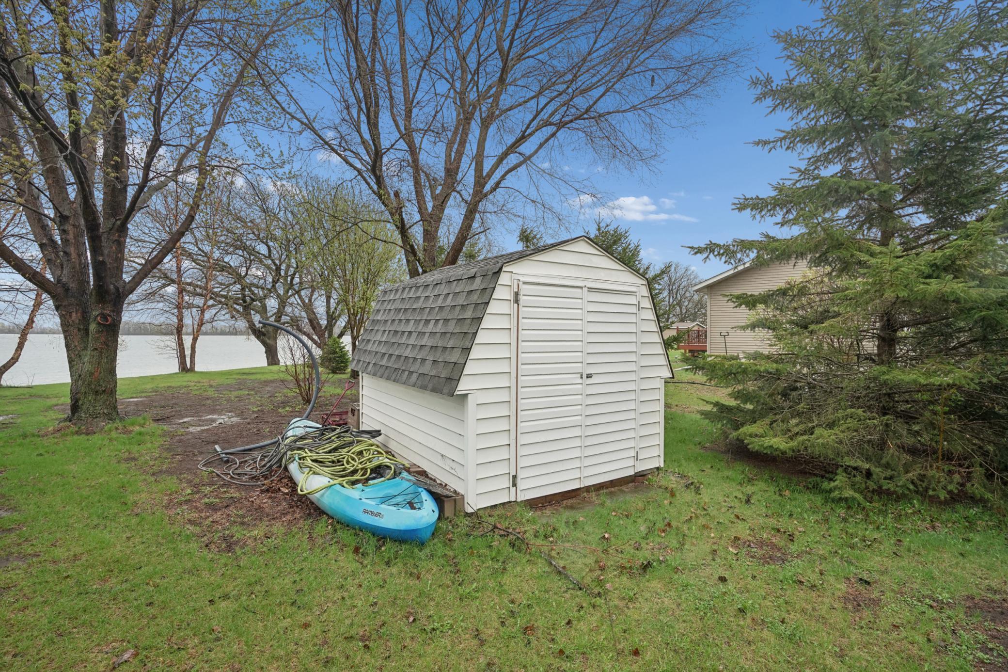 An additional storage shed is situated on the property. Kayaks are included.
