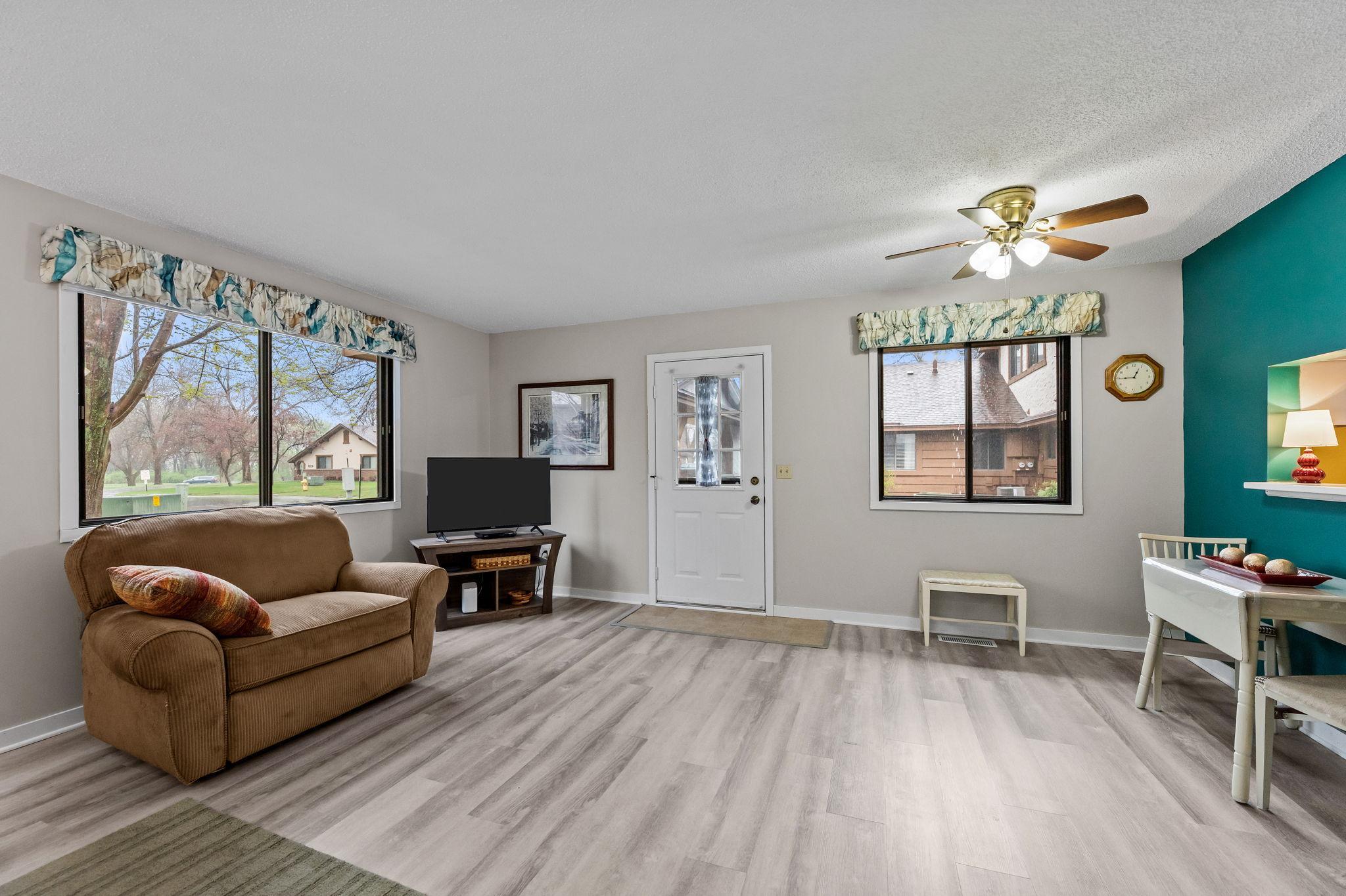 New LVP floors throughout, fresh paint, bright natural light and open plan.