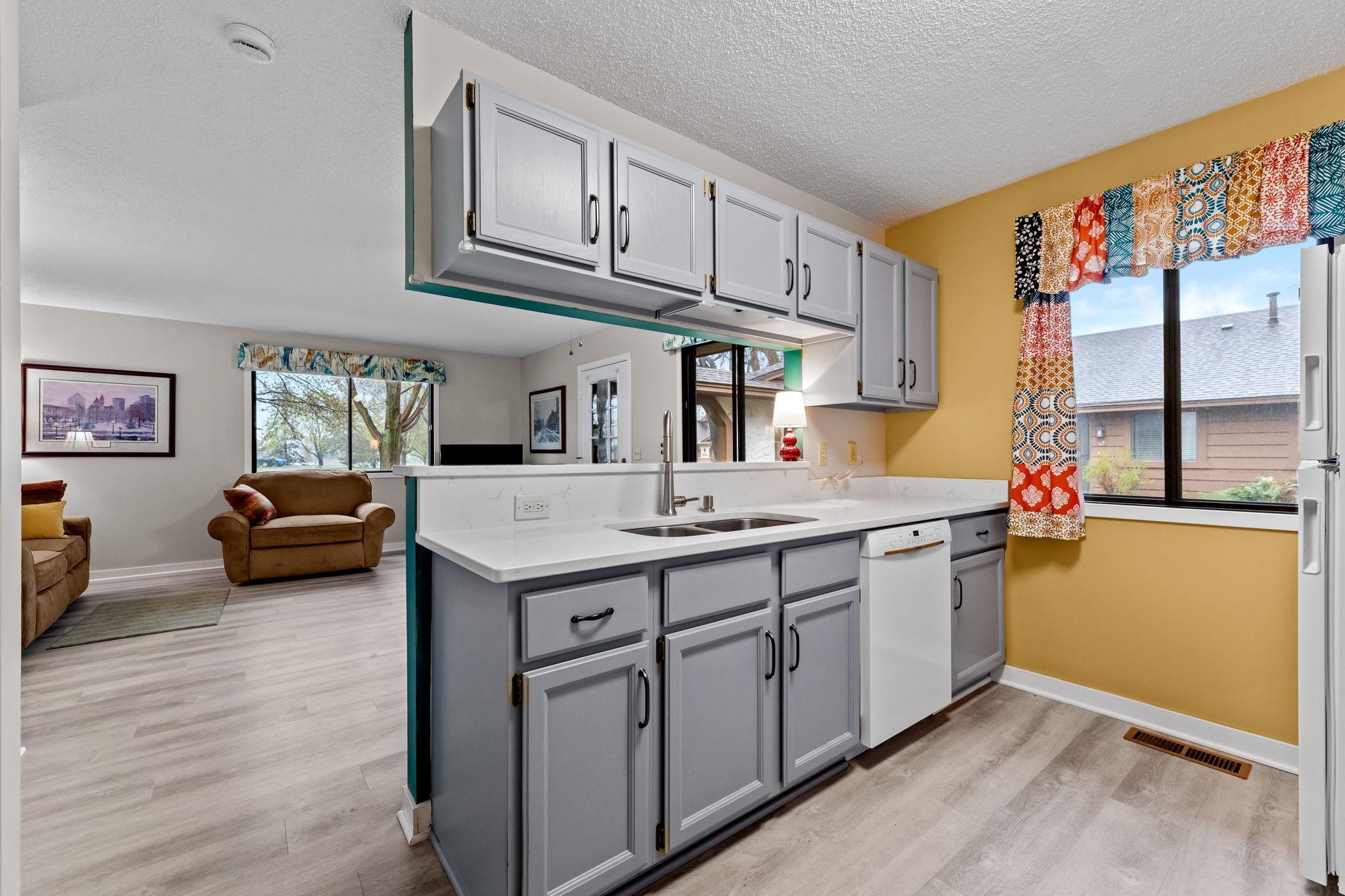 Solid quartz counter tops and huge under mount sink.