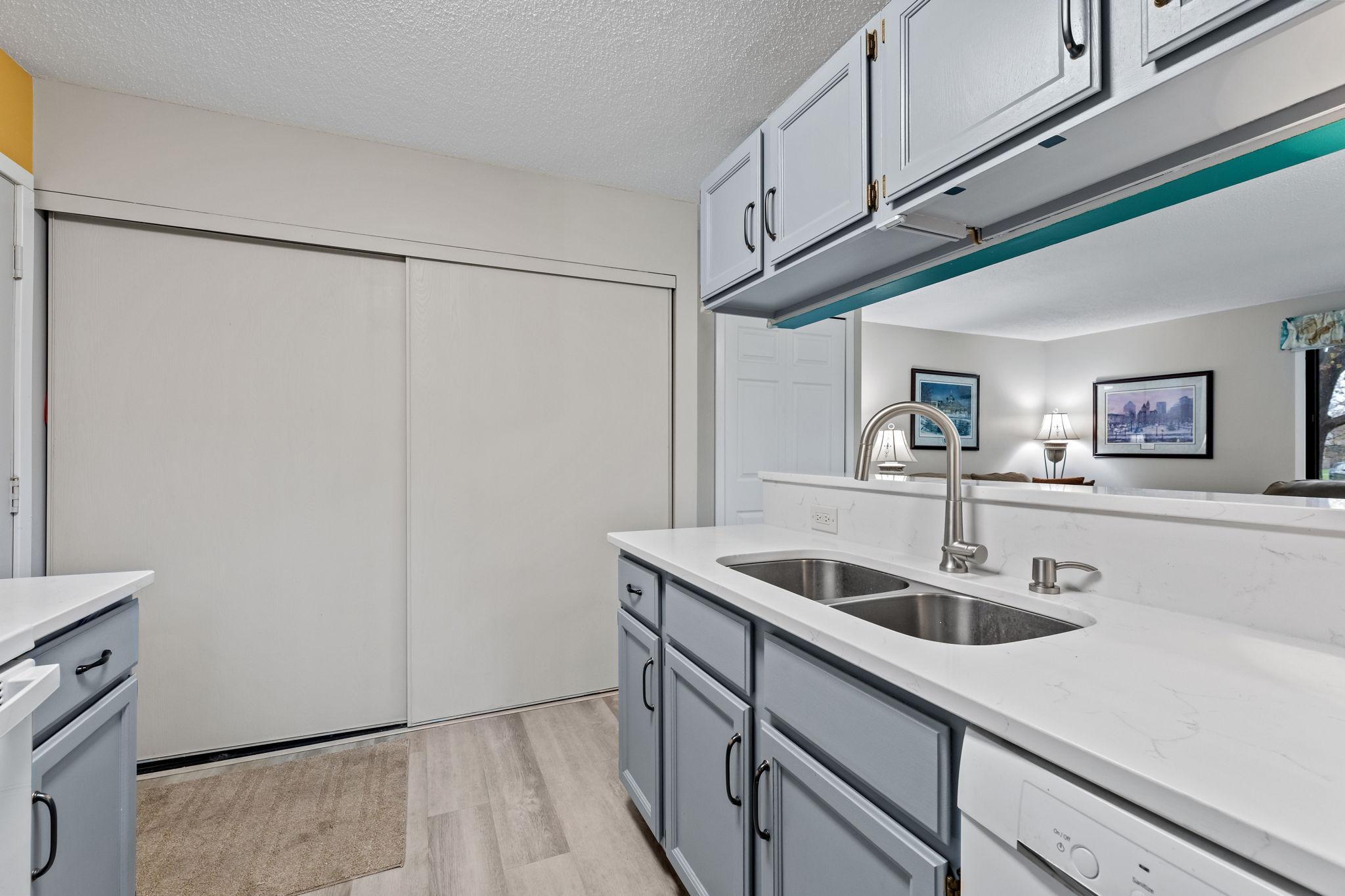 Large utility closet houses washer dryer, furnace and water heater.