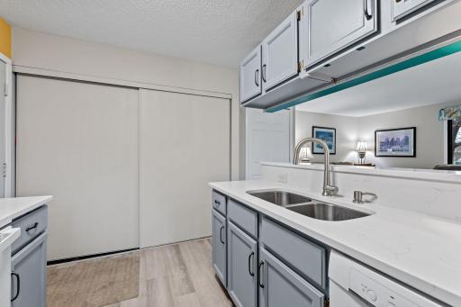 Large utility closet houses washer dryer, furnace and water heater.