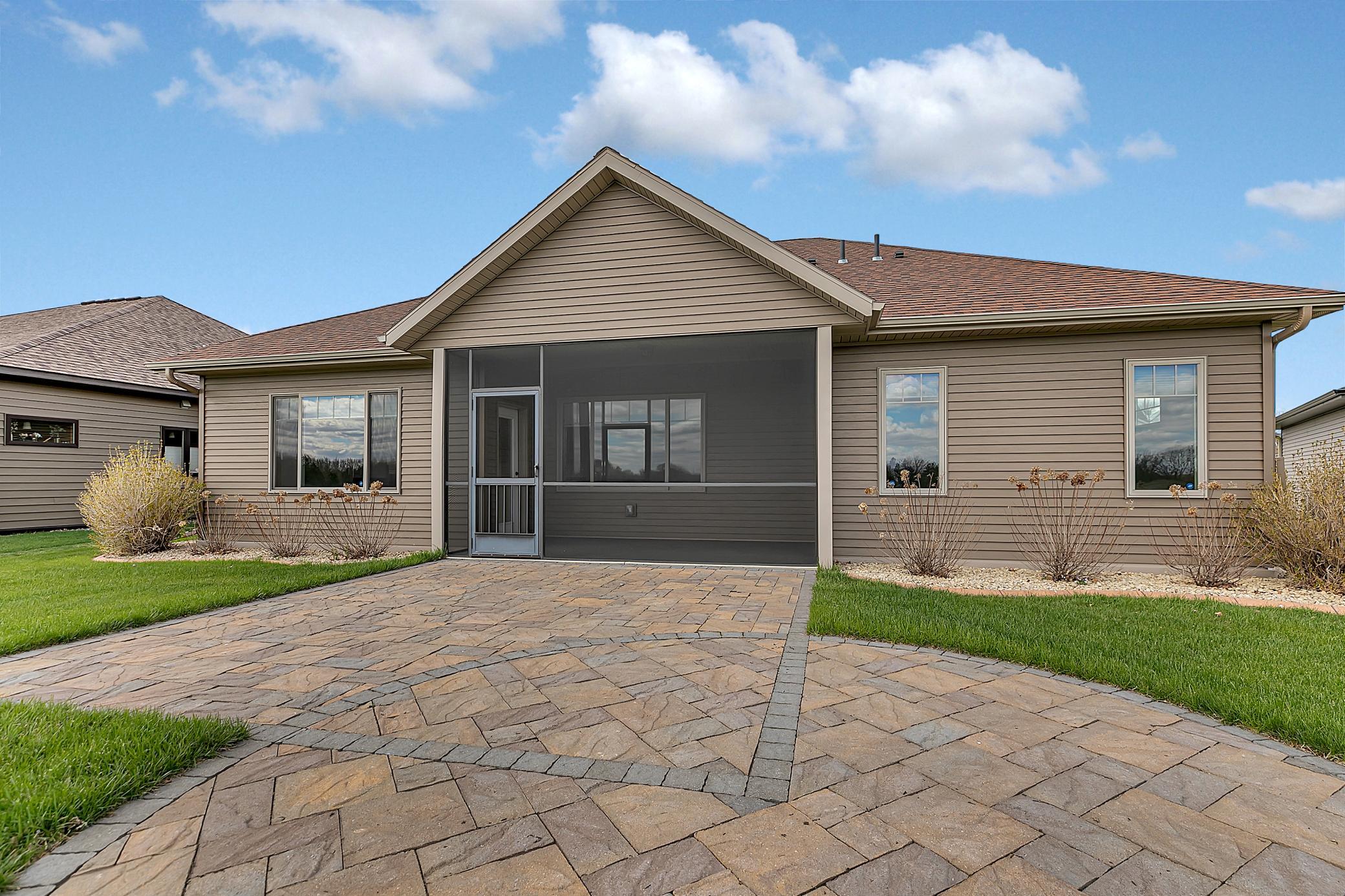 Enjoy quiet mornings or evening gatherings in the 8’ x 15’ screened-in rear porch with epoxy flooring.