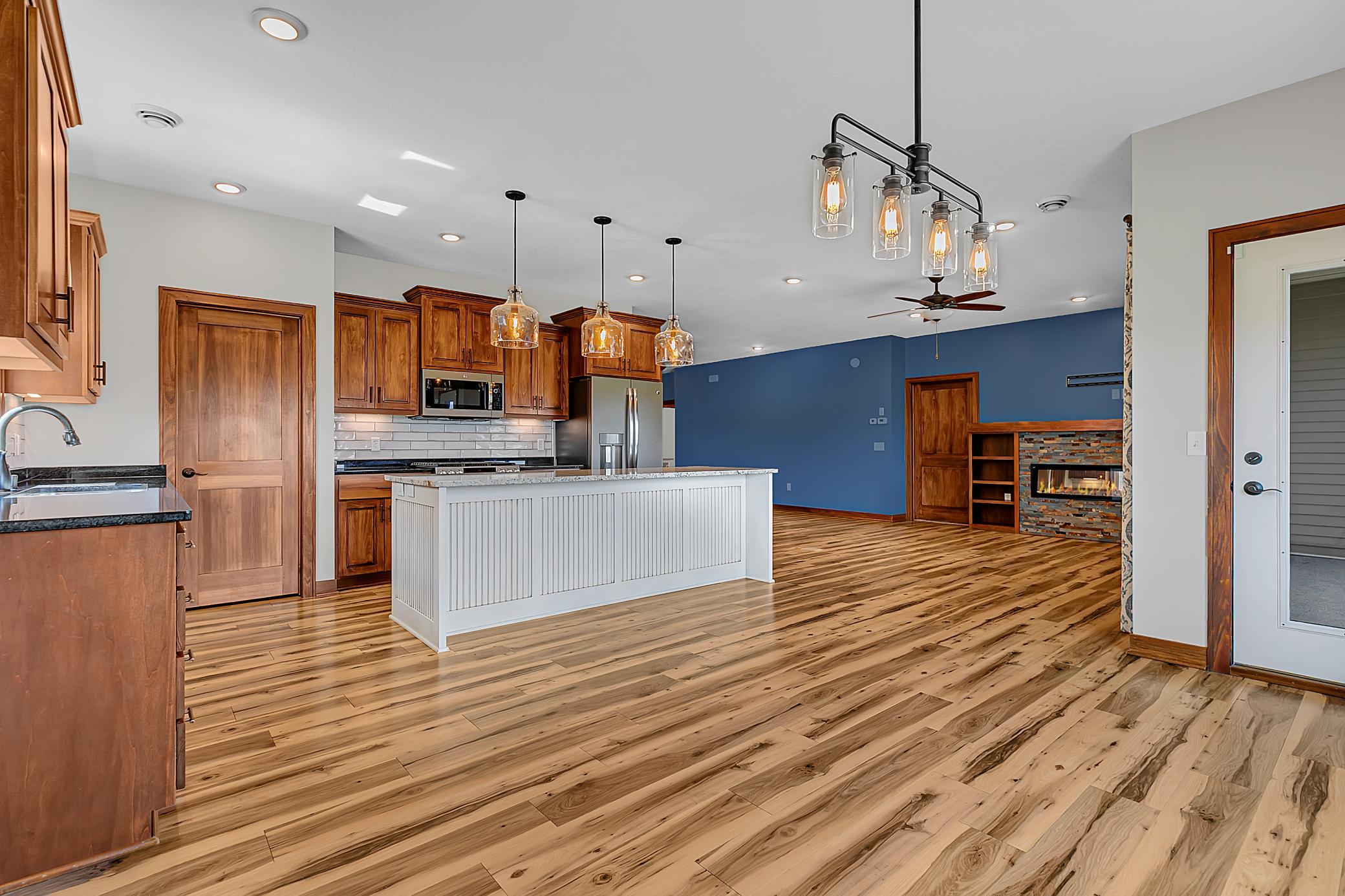 A generous 9-foot island offers additional seating when hosting gatherings.