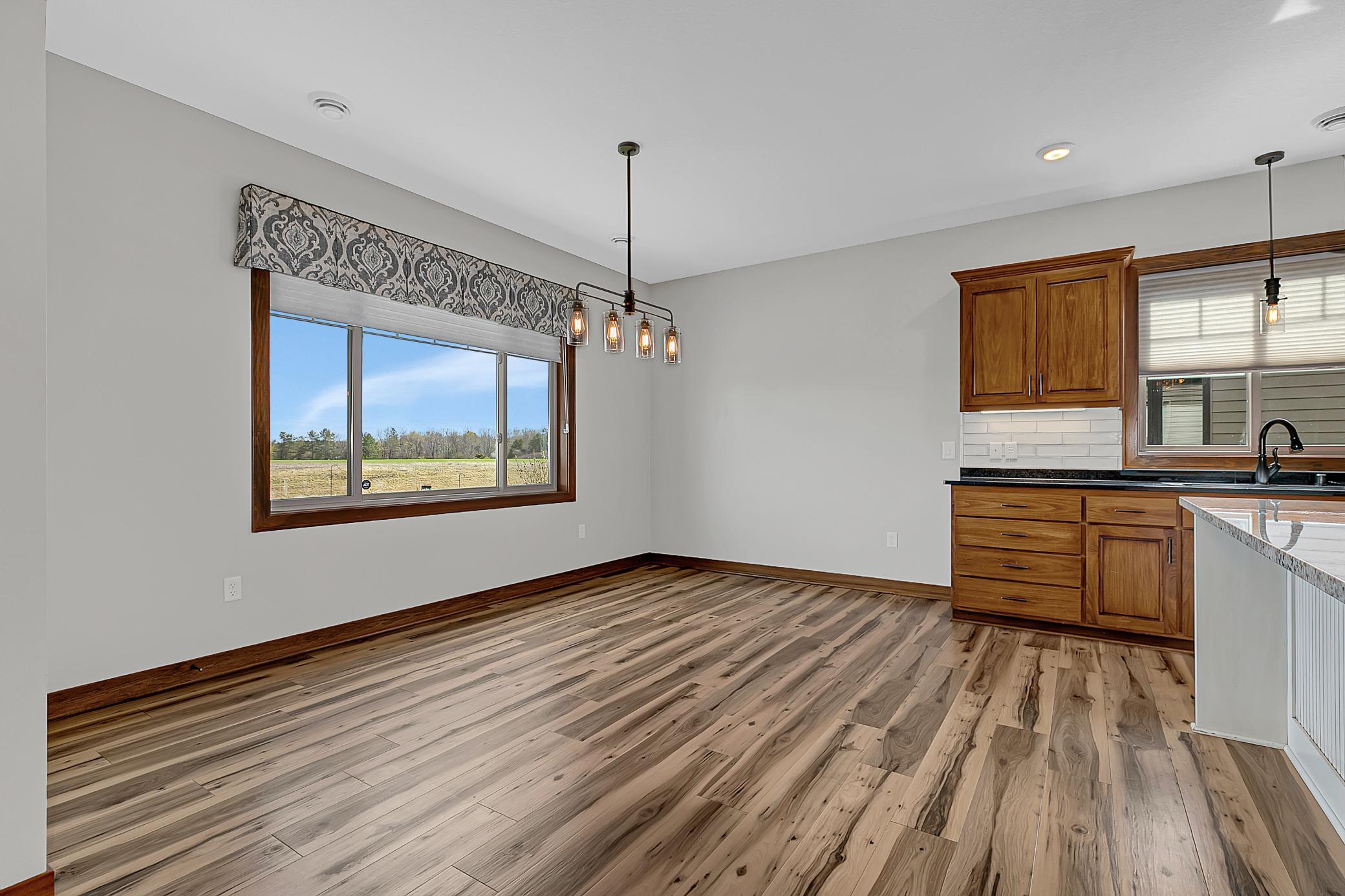 Dining room. This home blends thoughtful design with everyday comfort - the main level features in-floor heat throughout.