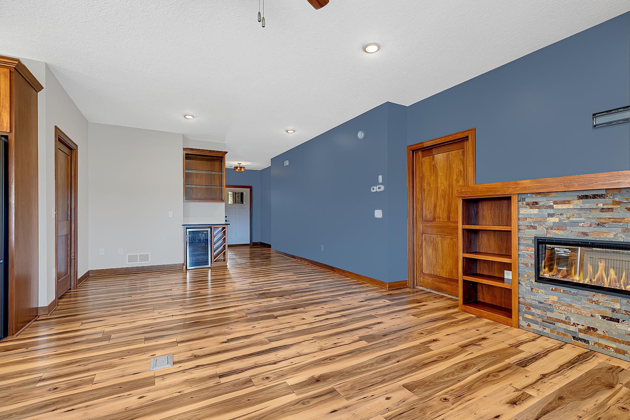 LED recessed lighting and knockdown ceilings carry throughout, enhancing the home’s modern yet comfortable feel.