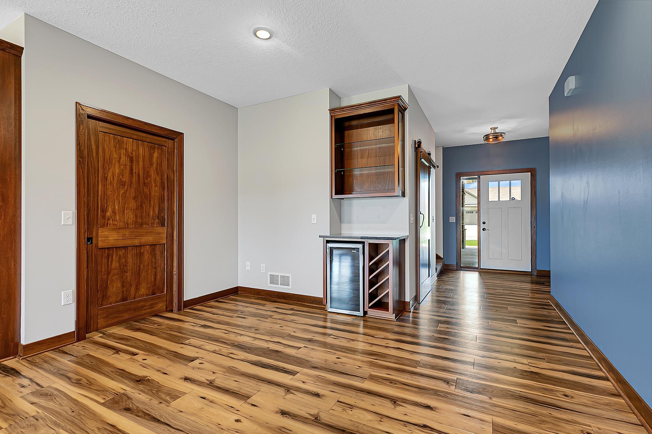 The wine and beverage area, with a mini fridge, adds a touch of convenience.