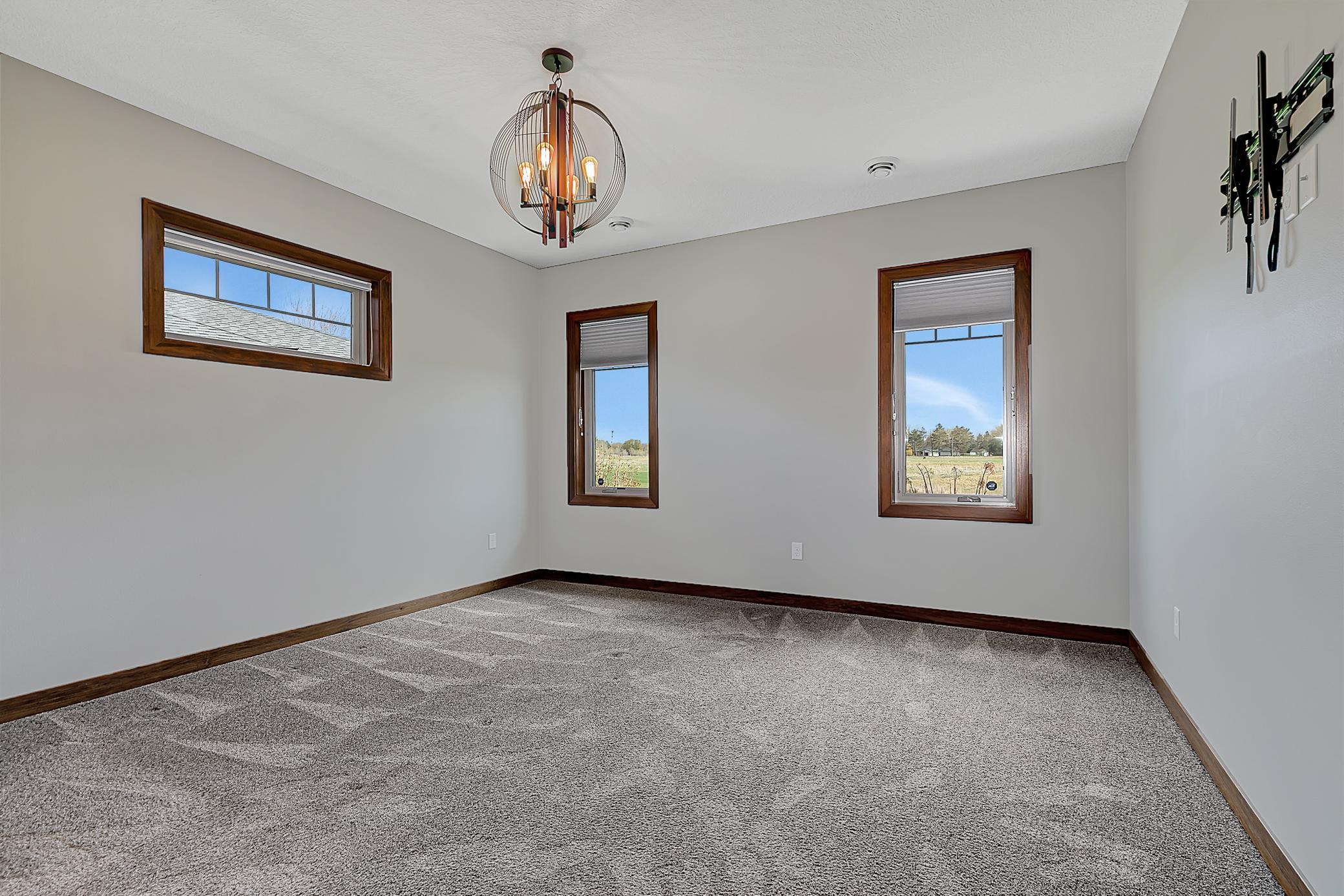 There are three main level bedrooms, one of them being this serene primary suite.
