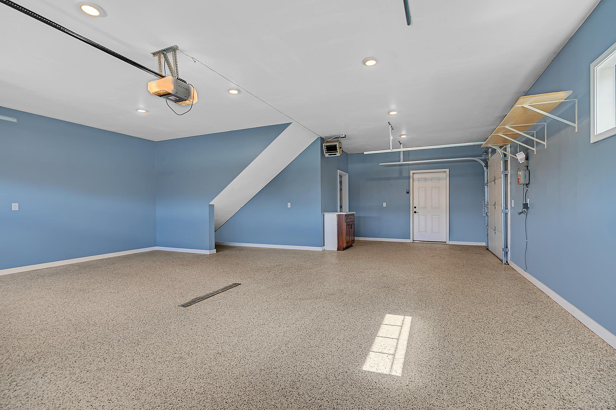 Car enthusiasts and hobbyists will appreciate the oversized, fully finished and heated garage.