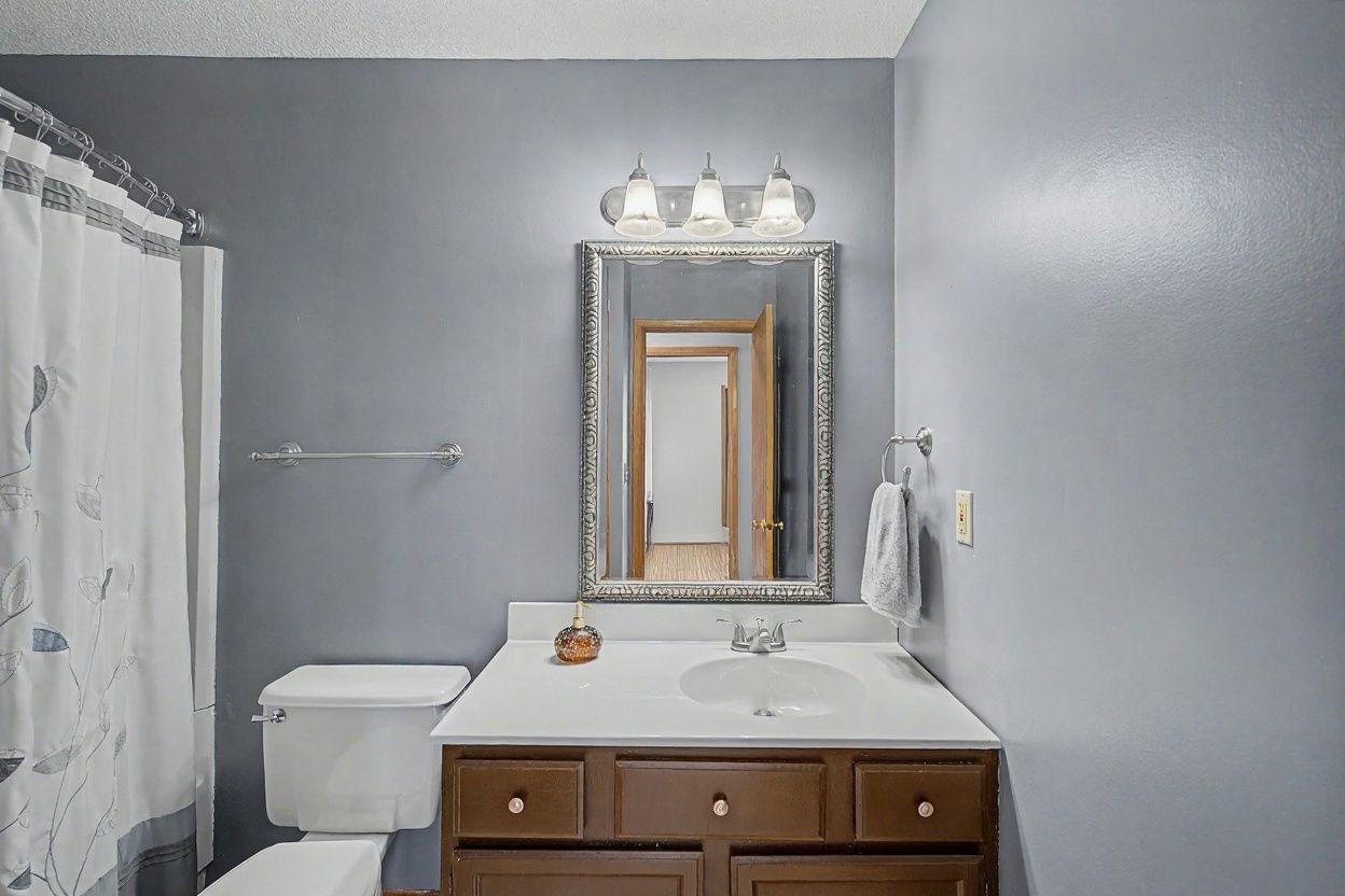 Handsome full bath has rainshower showerhead