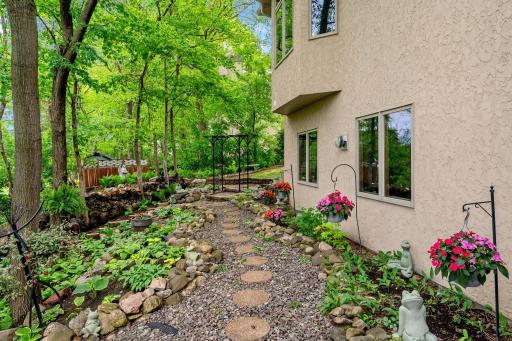 Meandering walkways behind the home to enjoy it's peaceful setting.
