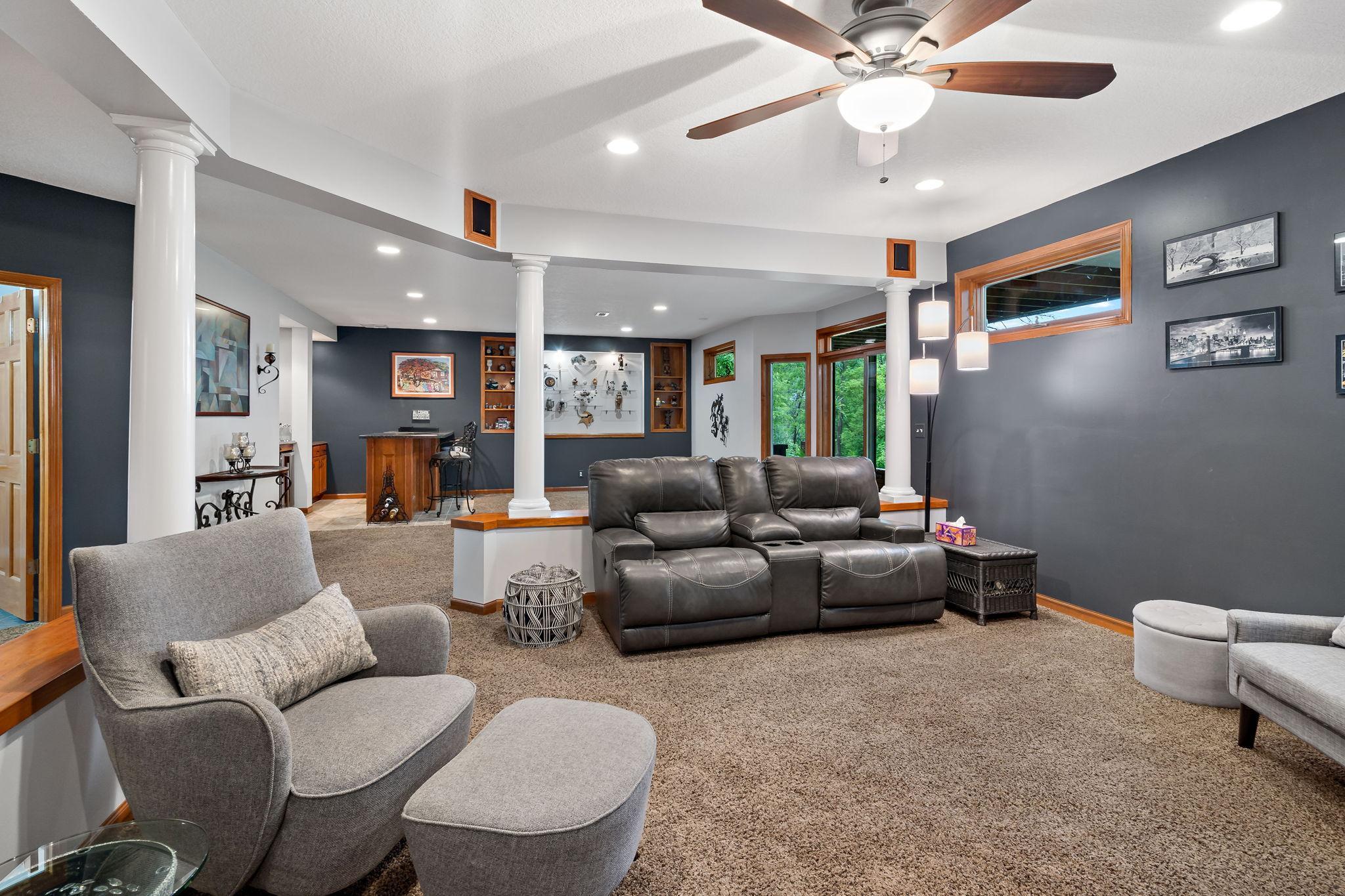 Basement family room connected to the wet bar and extra activity area.