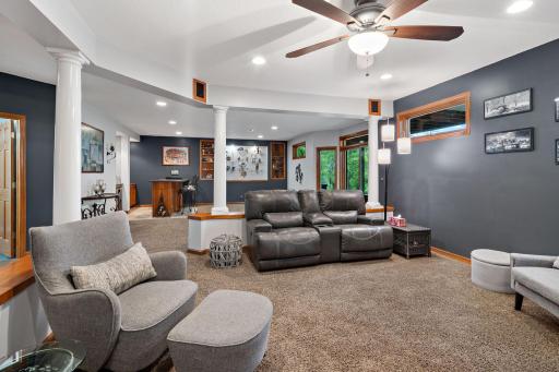 Basement family room connected to the wet bar and extra activity space.