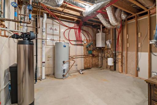 Mechanicals are located in the back of the storage room. Boiler, water heater, water softener, sump pump, and radon mitigation system.