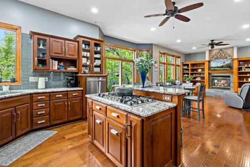 Cook top is part of the kitchen island with granite countertops.