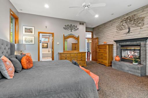 Private ensuite and fireplace in the primary bedroom.