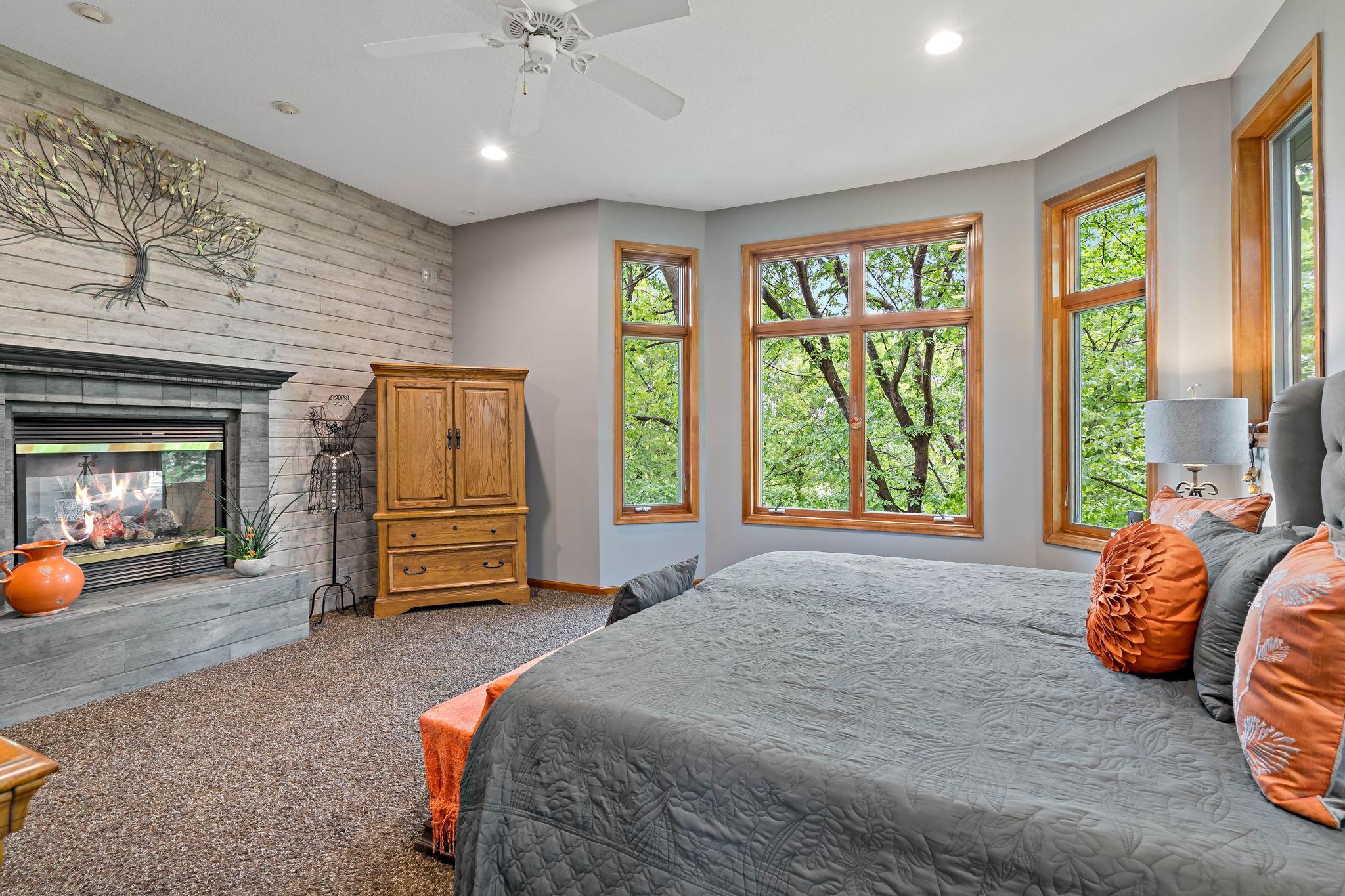 Large windows look out into the trees and golf course.