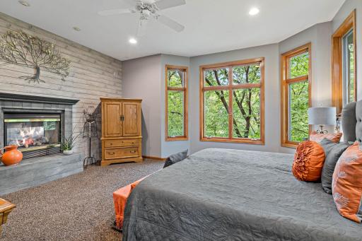 Large windows look out into the trees and golf course.