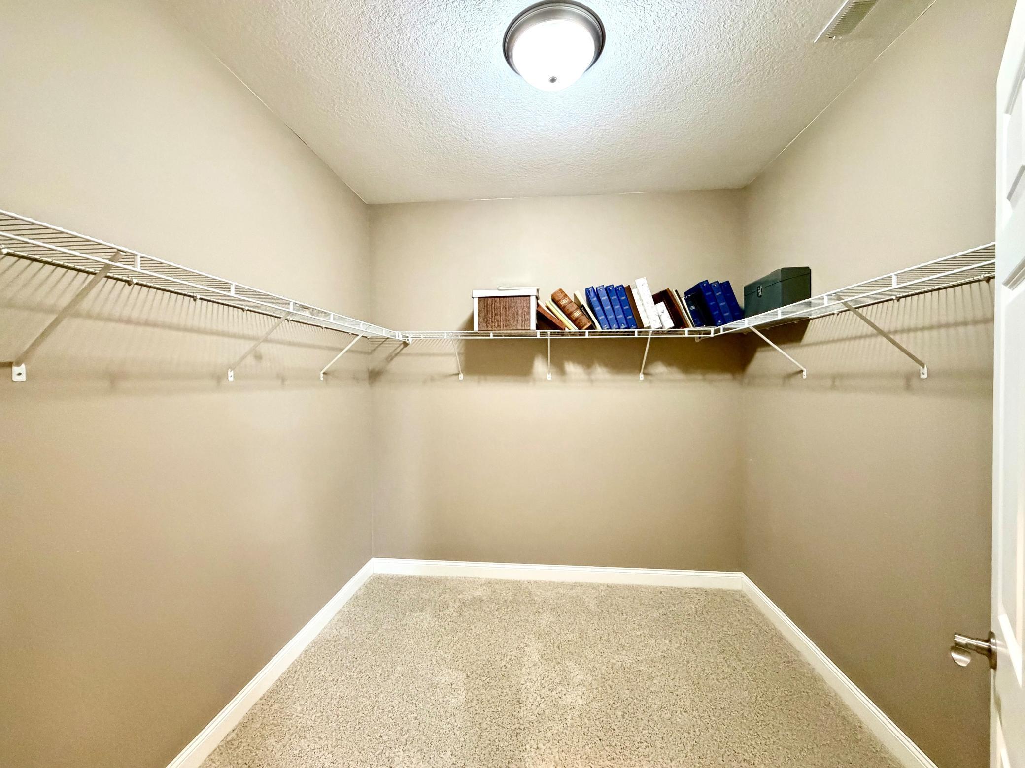 Primary bedroom walkin closet.jpg