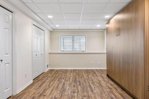 Bedroom in lower level comes with a custom murphy bed.