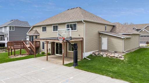 Make sure and check out this AWESOME backyard. A sports court, grass to play, a new deck, a pergola and all wired for a hot tub!