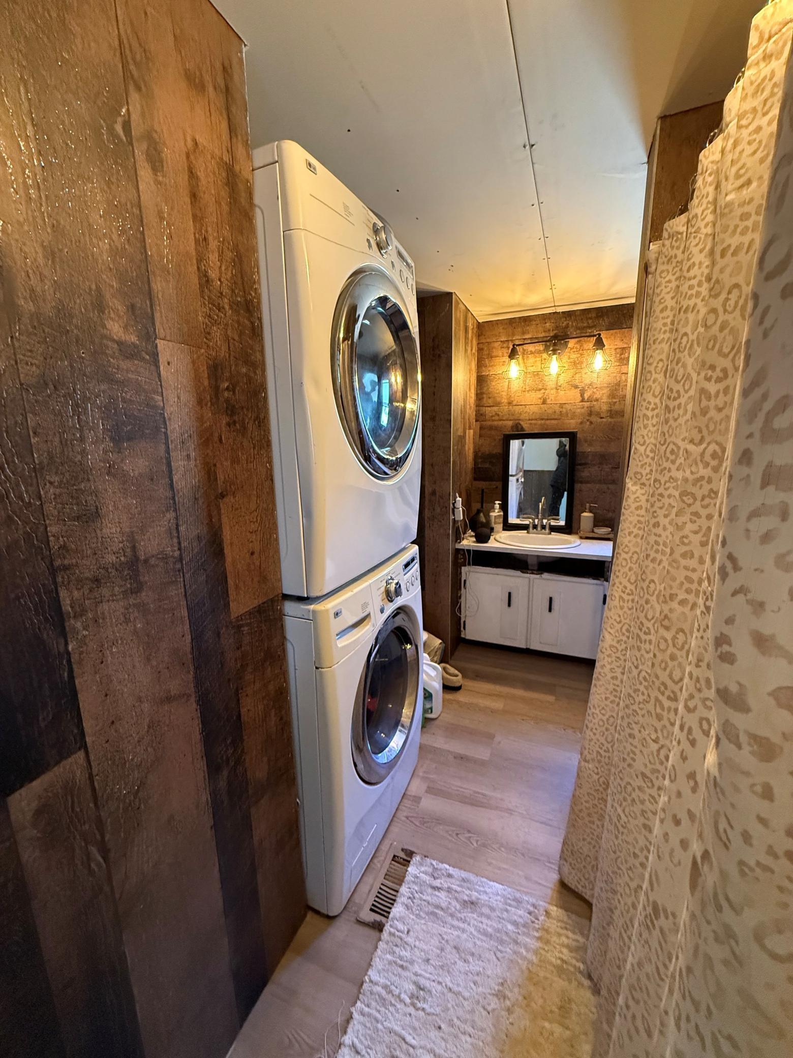 Stacked front end washer/dryer in bathroom