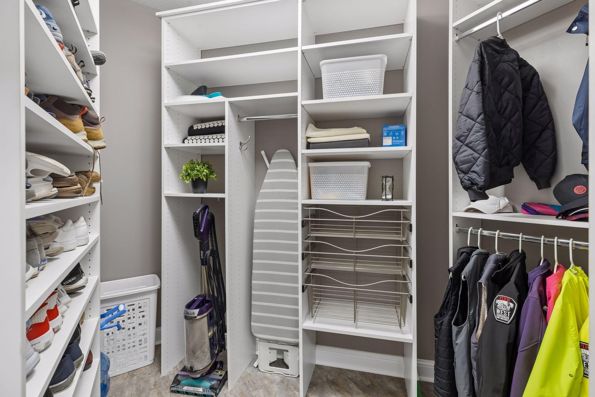 Huge mudroom closet with custom organizers. Keep all the shoes, coats, vacuums, etc. behind closed doors and out of the way!