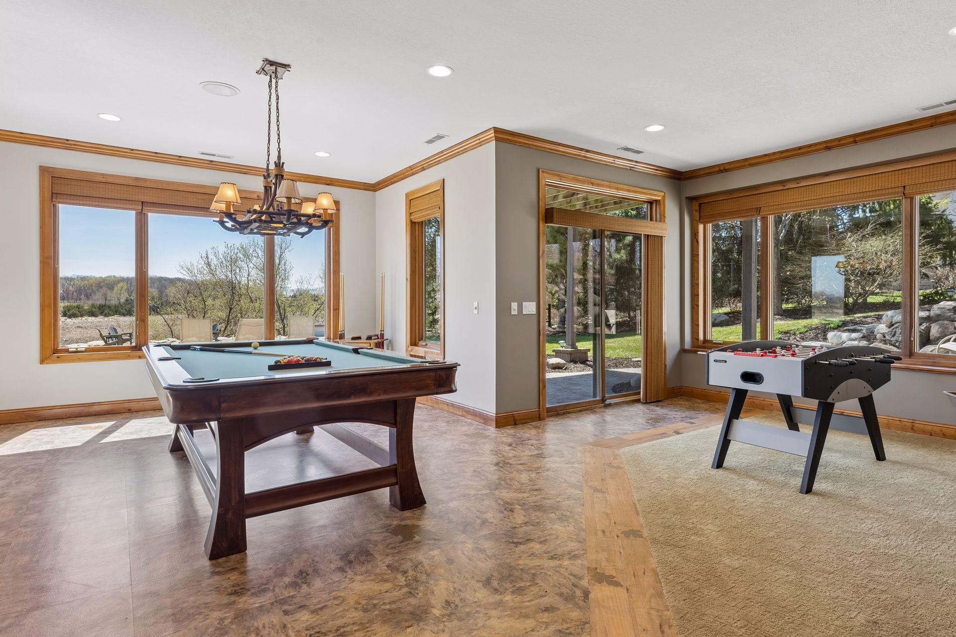 Game room with unique flooring. Views of marsh and boulder grotto