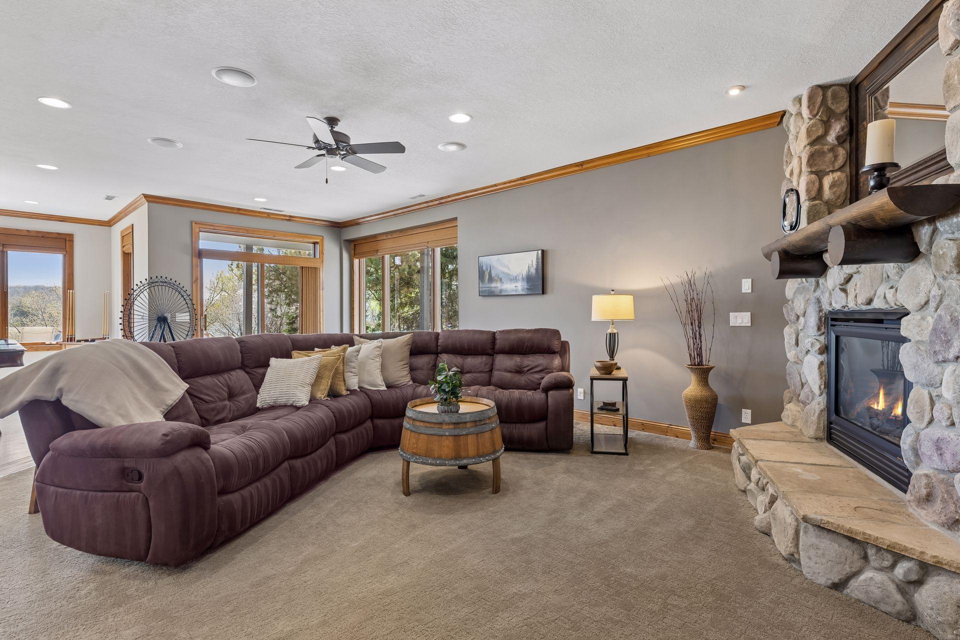 Family room with cozy gas-burning stone fireplace