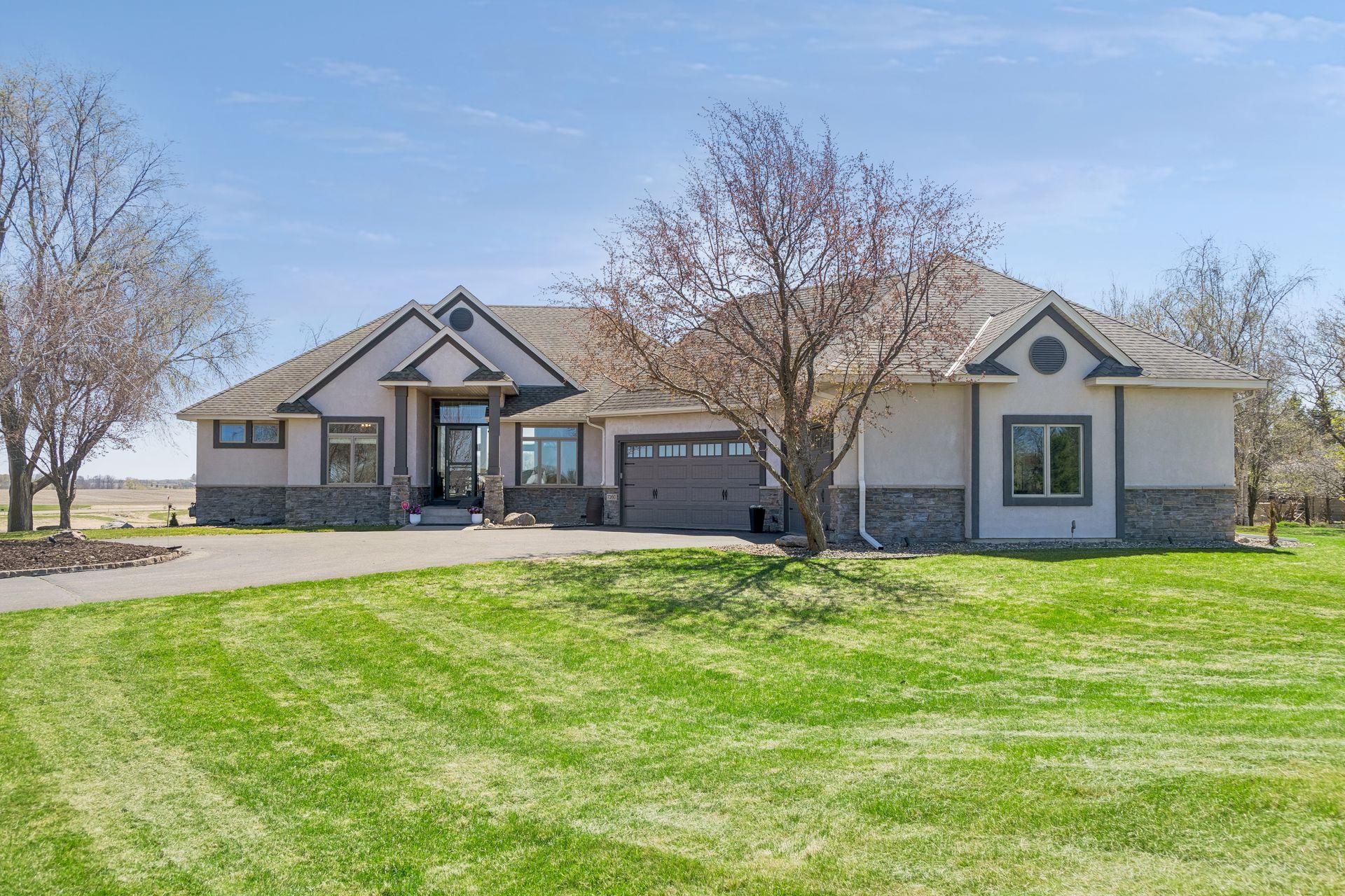 7260 Jubert Lane - Stucco front with stone accents