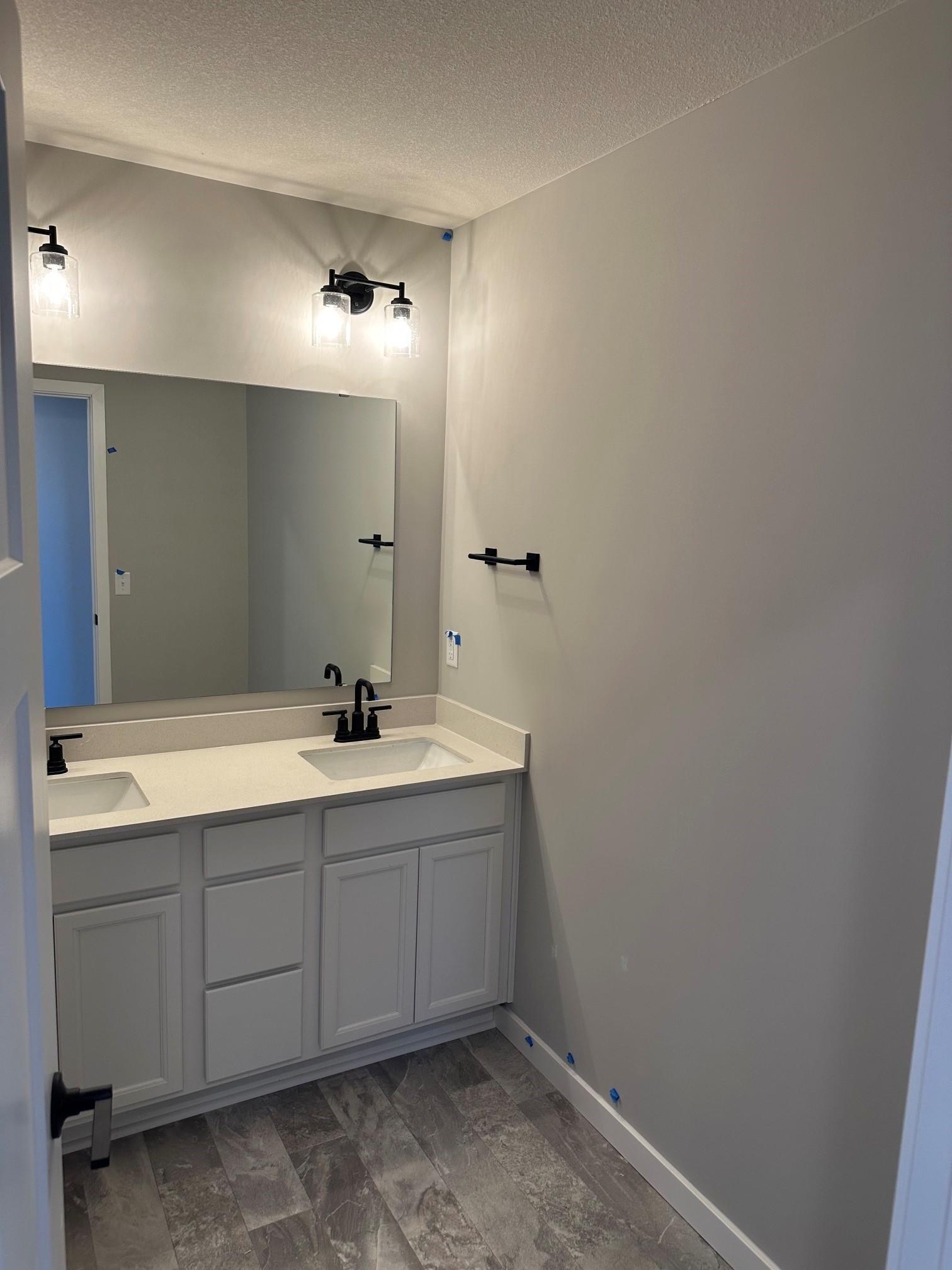 The main hall bath also features upgraded hardware.jpg