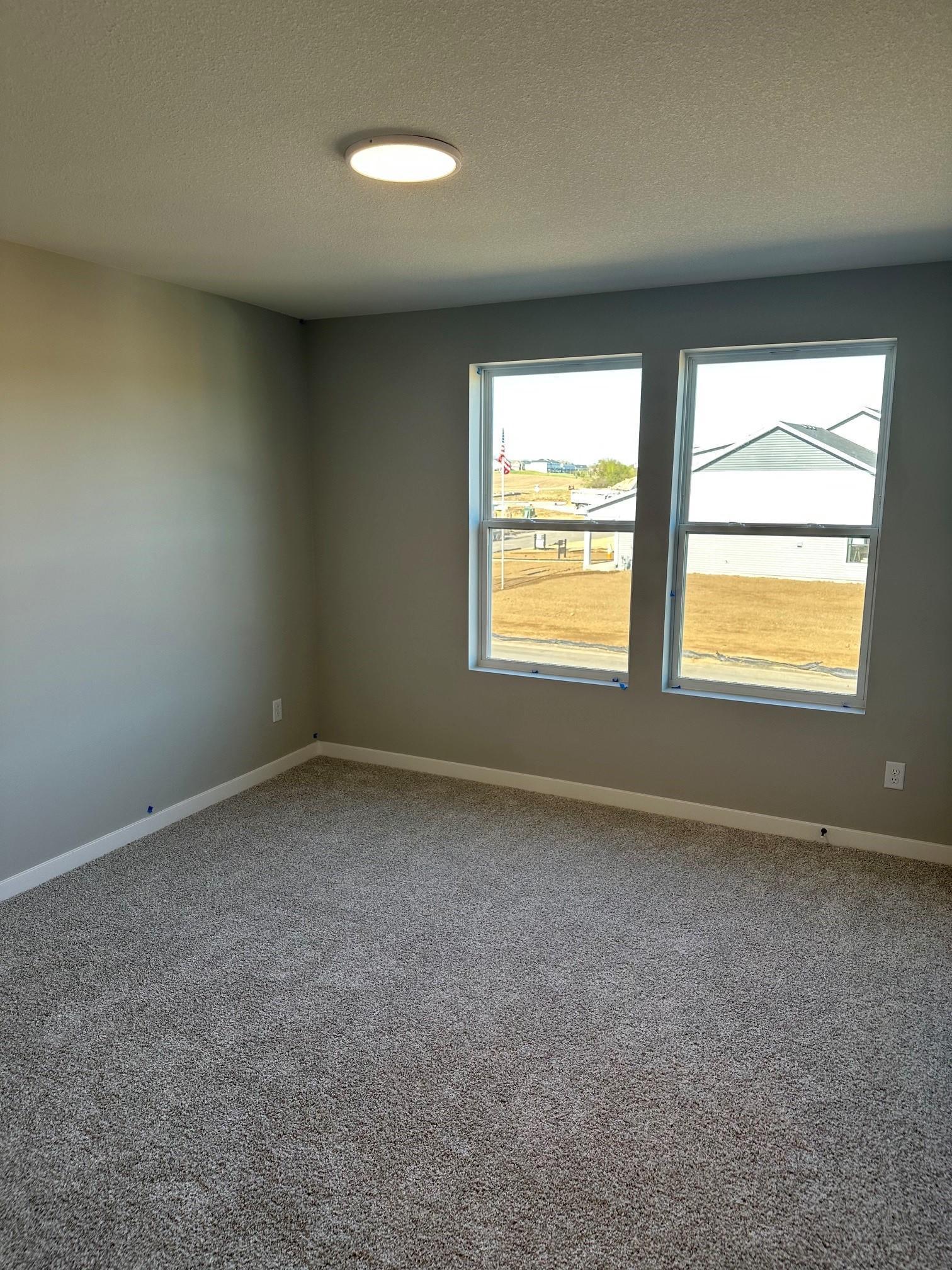 This secondary bedroom has a large walk in closet.jpg