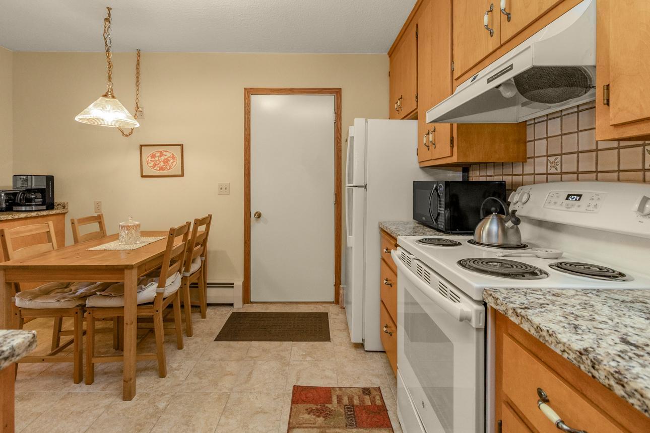 Kitchen leads to the garage