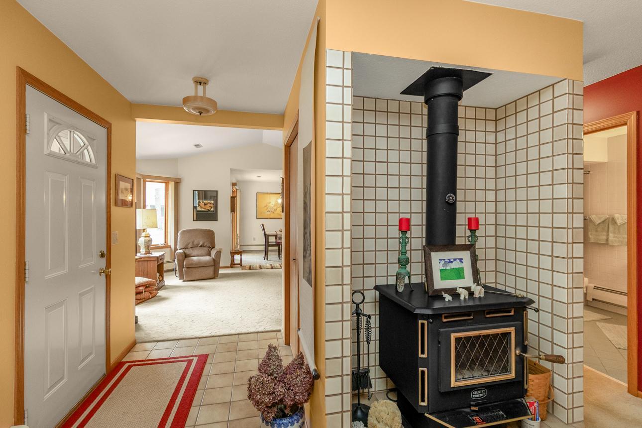 Wood burning stove off of the entry