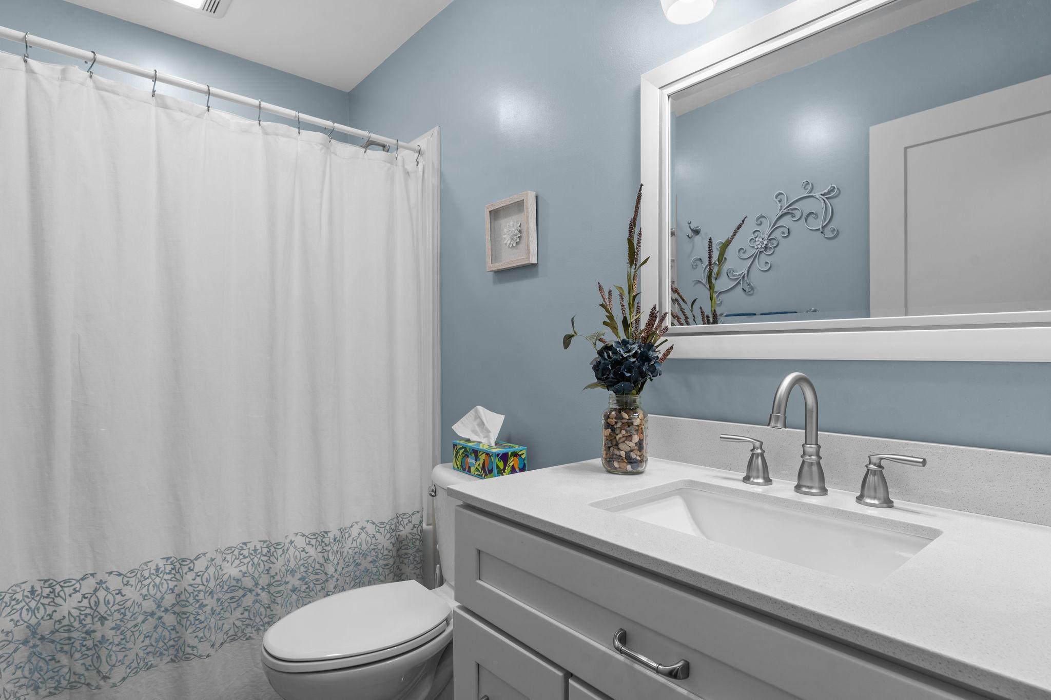 Main level full bathroom.