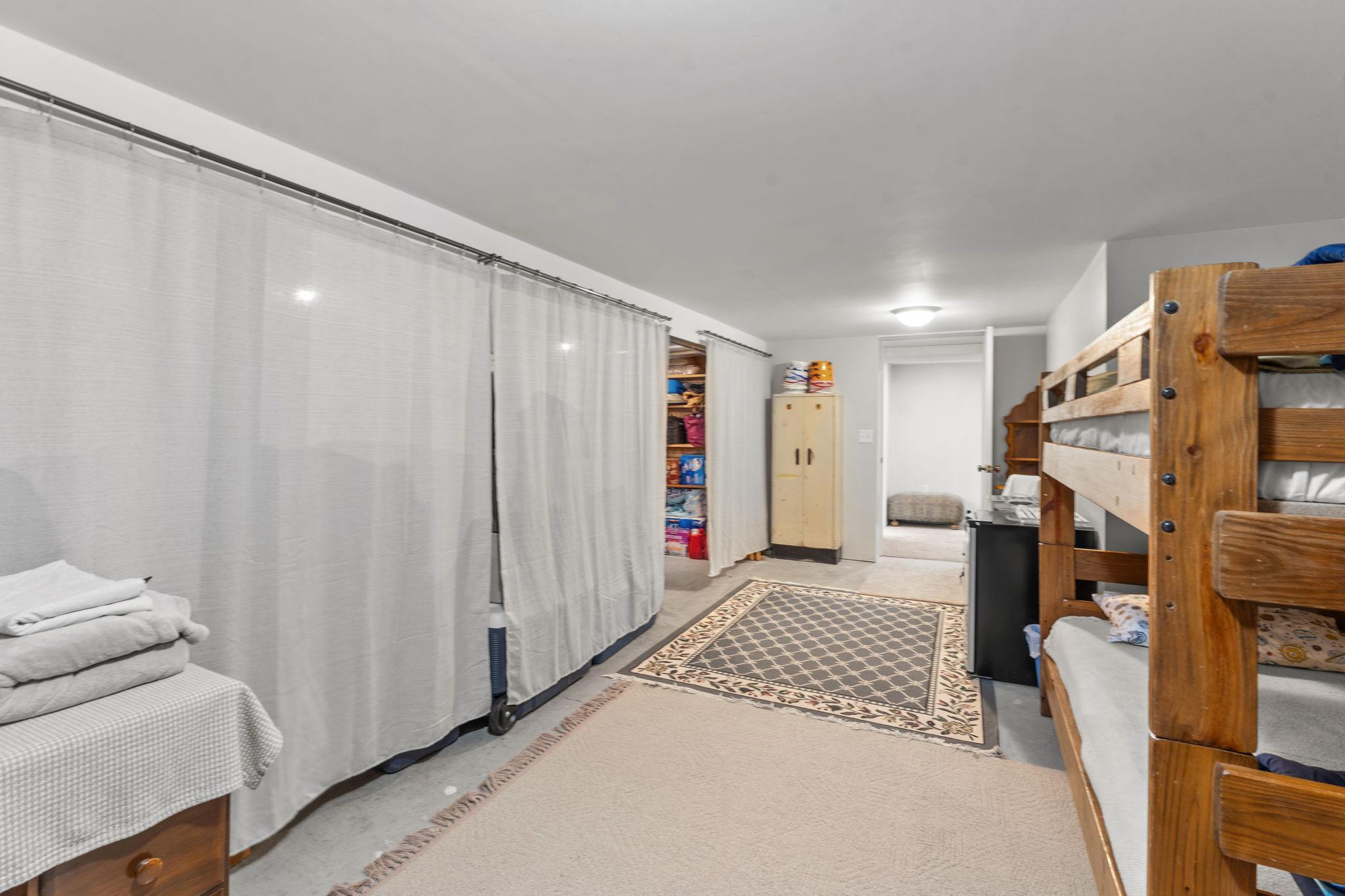 This could be finished with more carpet or could be turned into a large shop space! Craft room?