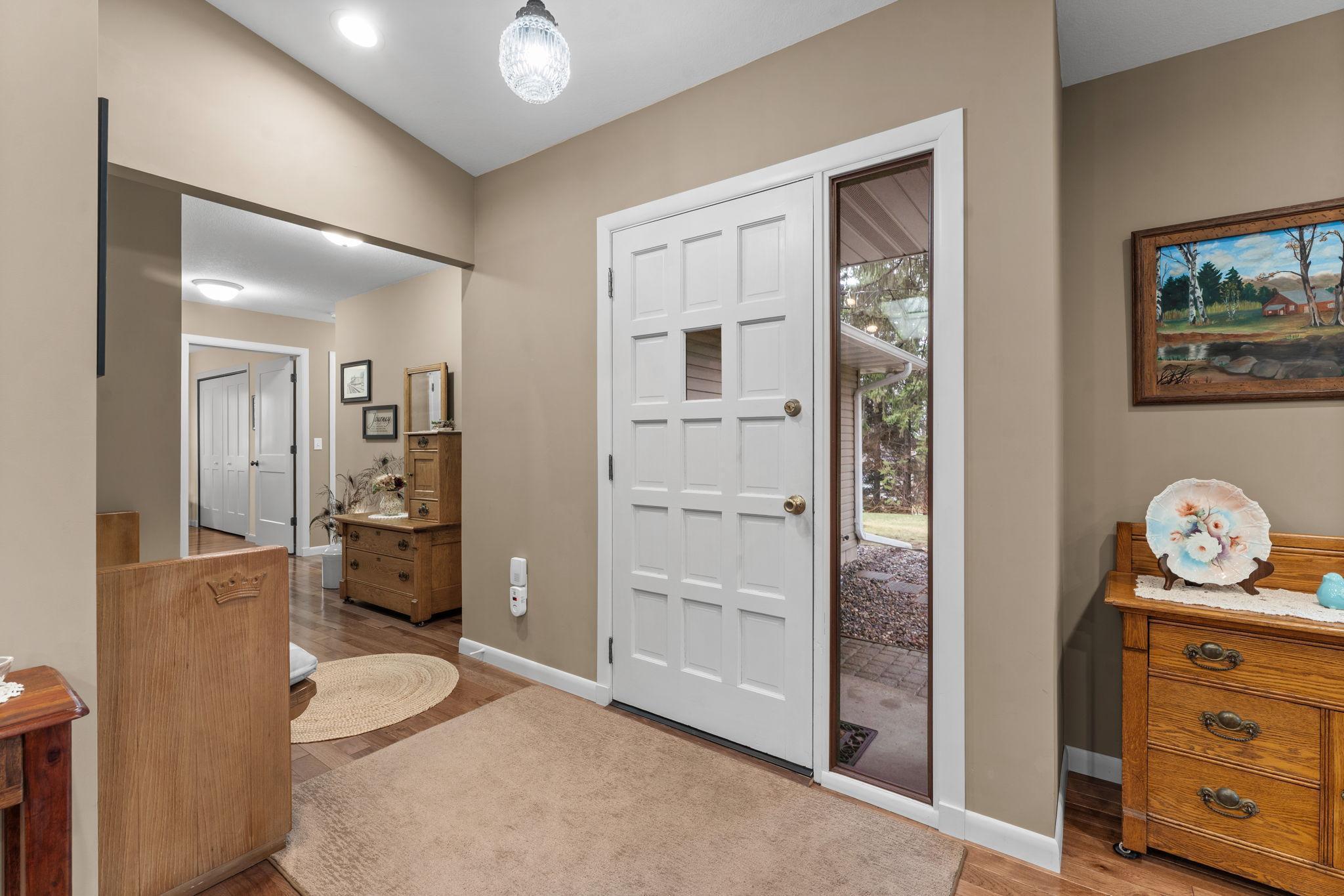 The front entry leads to a large foyer or the bright, vaulted great room.