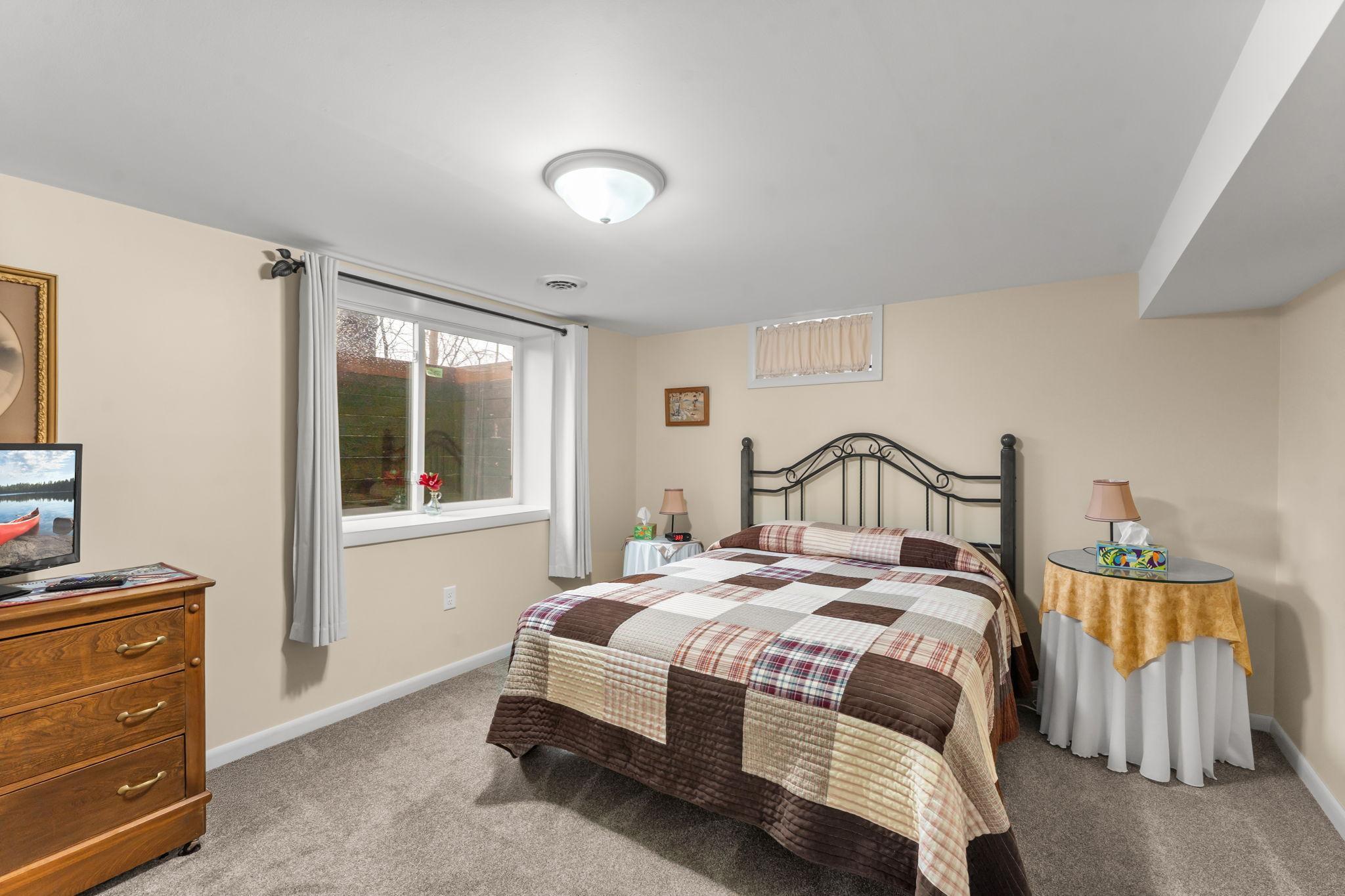Bedroom #3 downstairs with an egress window.